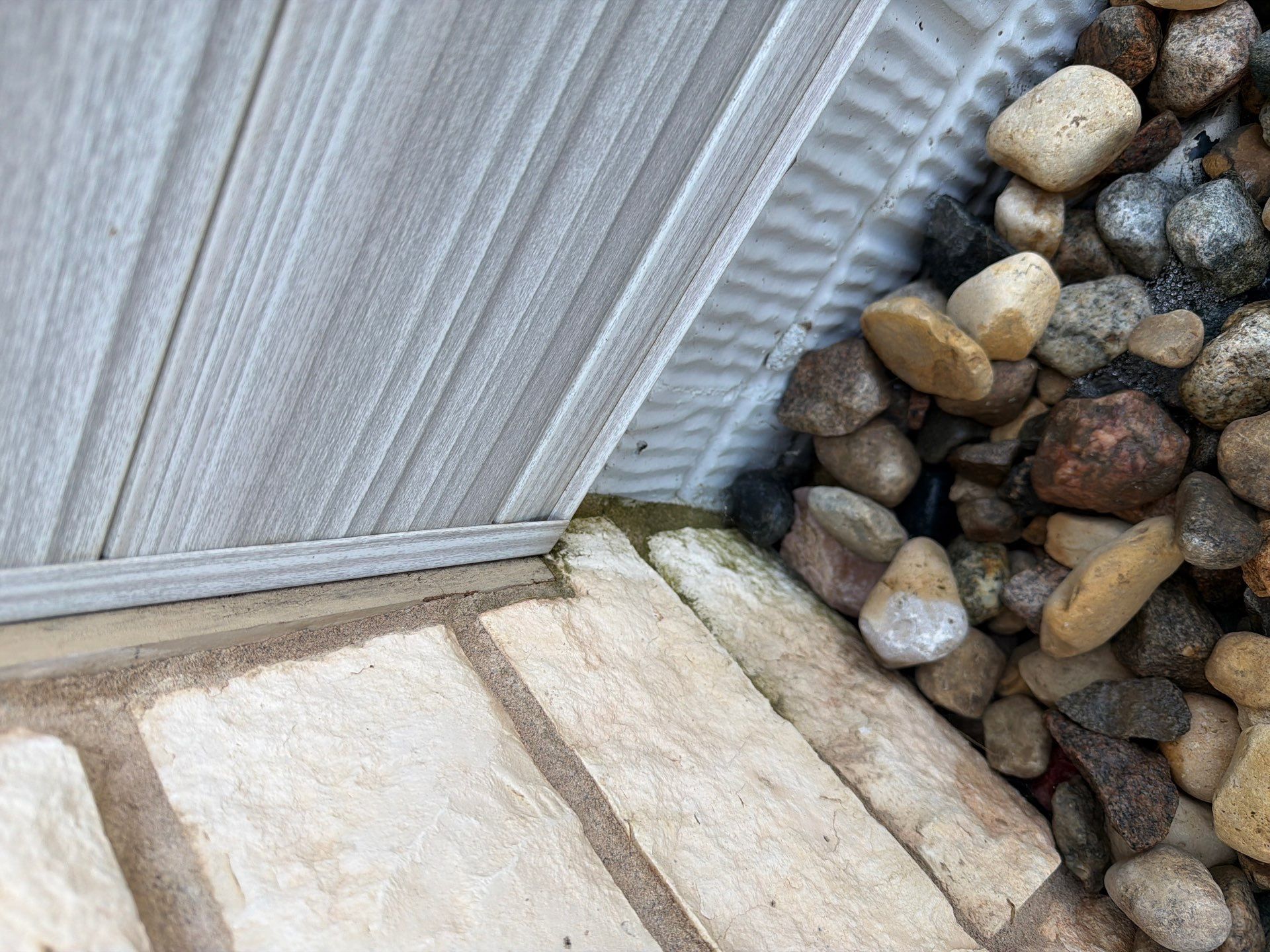 Modern Exterior Update with Siding and Stone Masonry in Sioux Falls by Select Painting, Coatings & Garage Cabinets