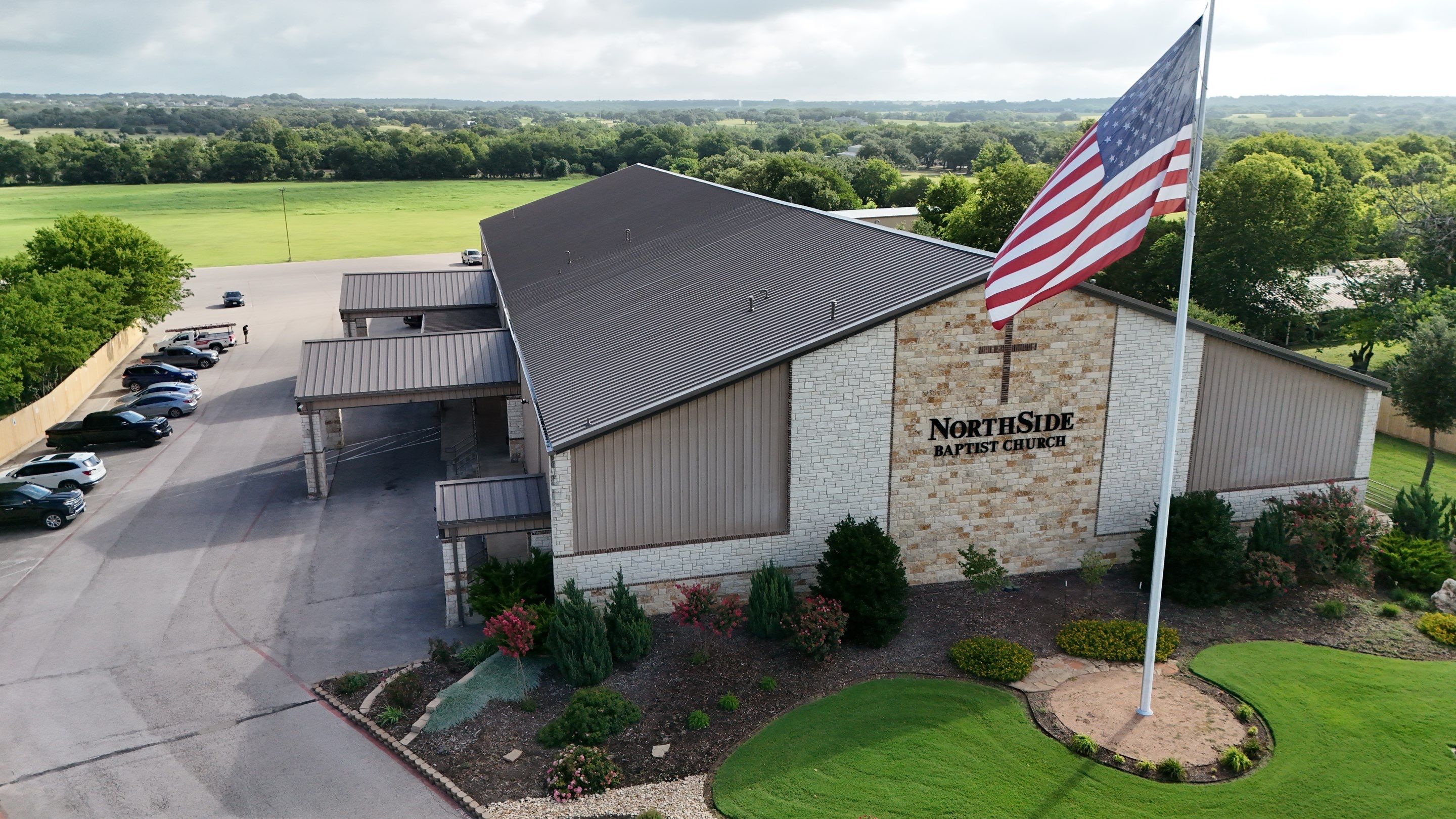 Commercial Roofing Installation using 24 GA 2" Seam Metal Retrofin - Buckskin by Action Exteriors Austin