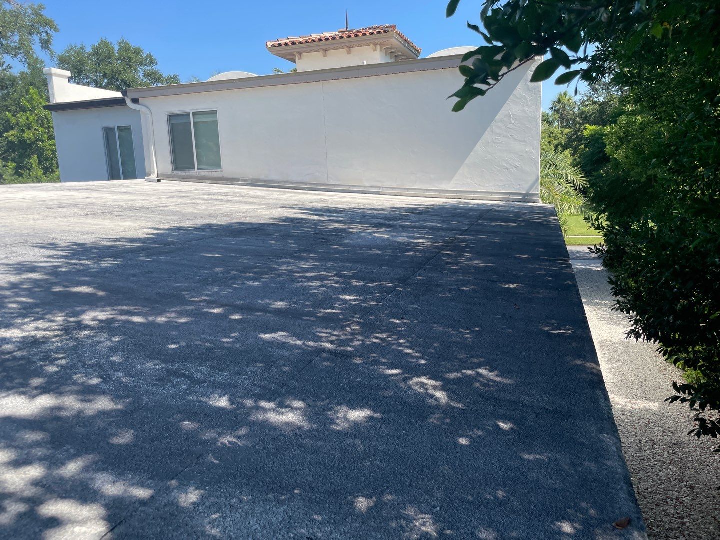 Residential Flat Roof Membrane and Tile Accents in Winter Park by Tip Top Roofing Co., Inc.