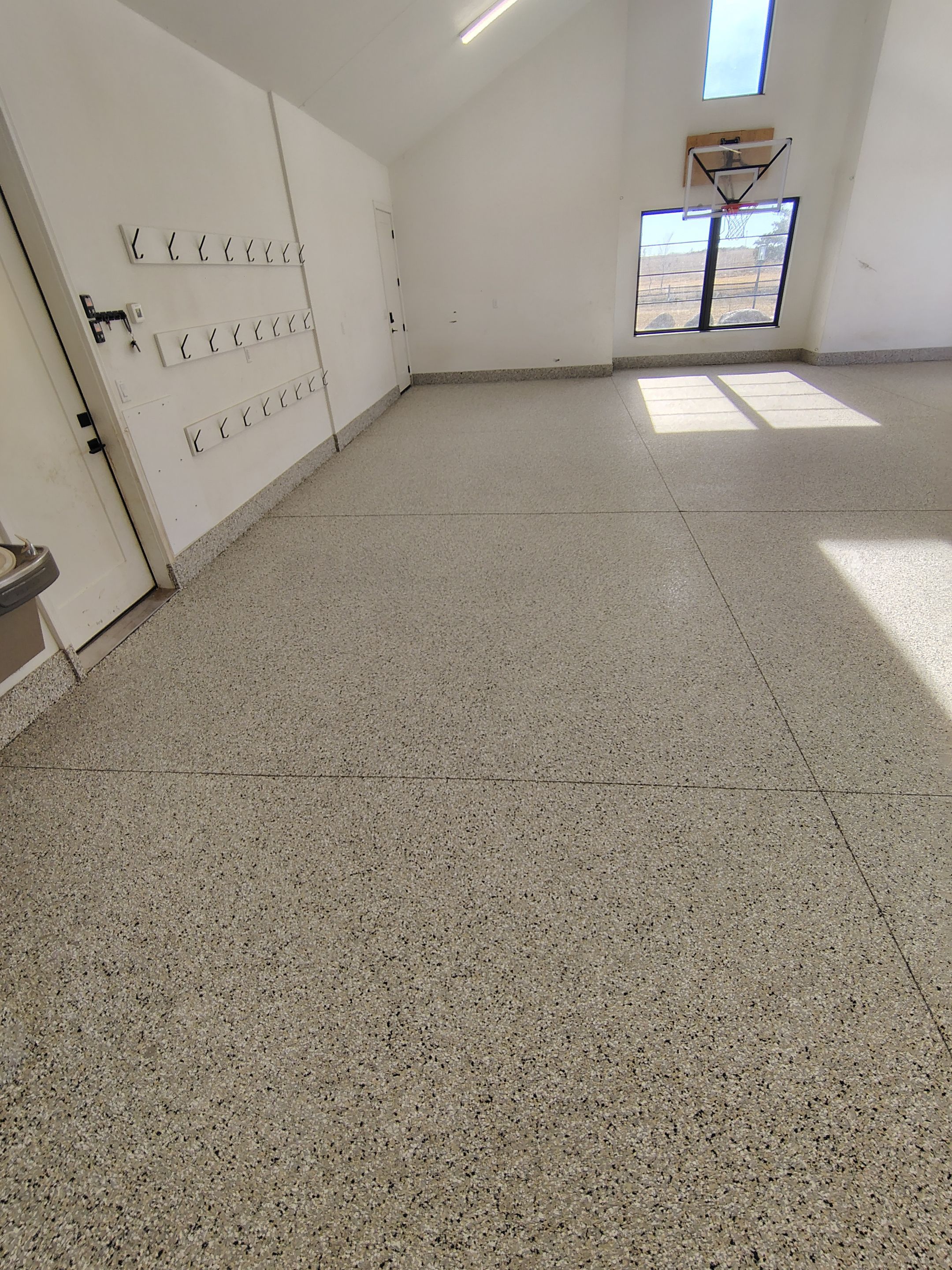 Epoxy Flake Garage Floor and Stair Coating in Sioux Falls by Select Painting, Coatings & Garage Cabinets