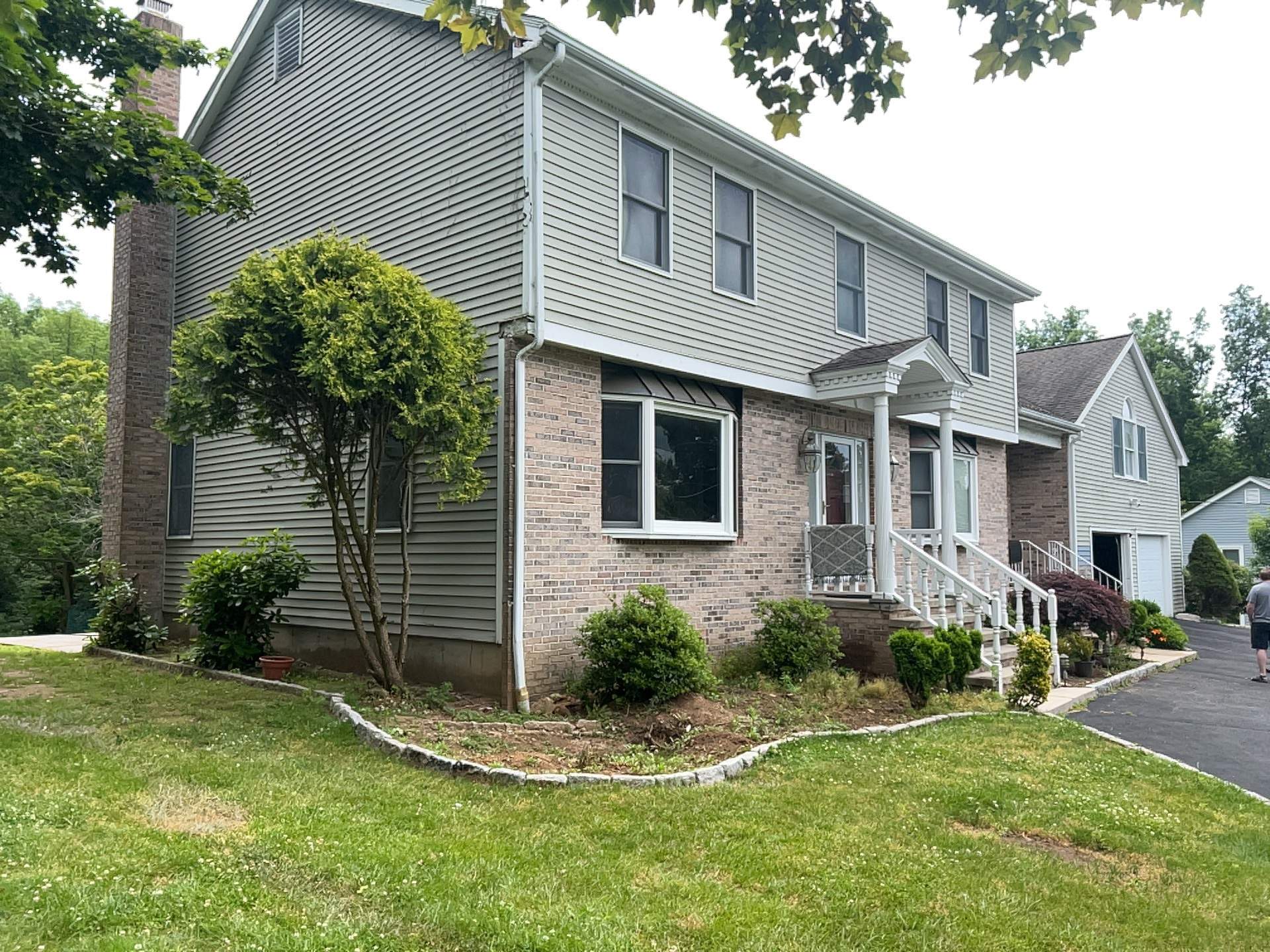 Siding Installation using Mainstreet Colonial & White gutters by A Plus Exterior