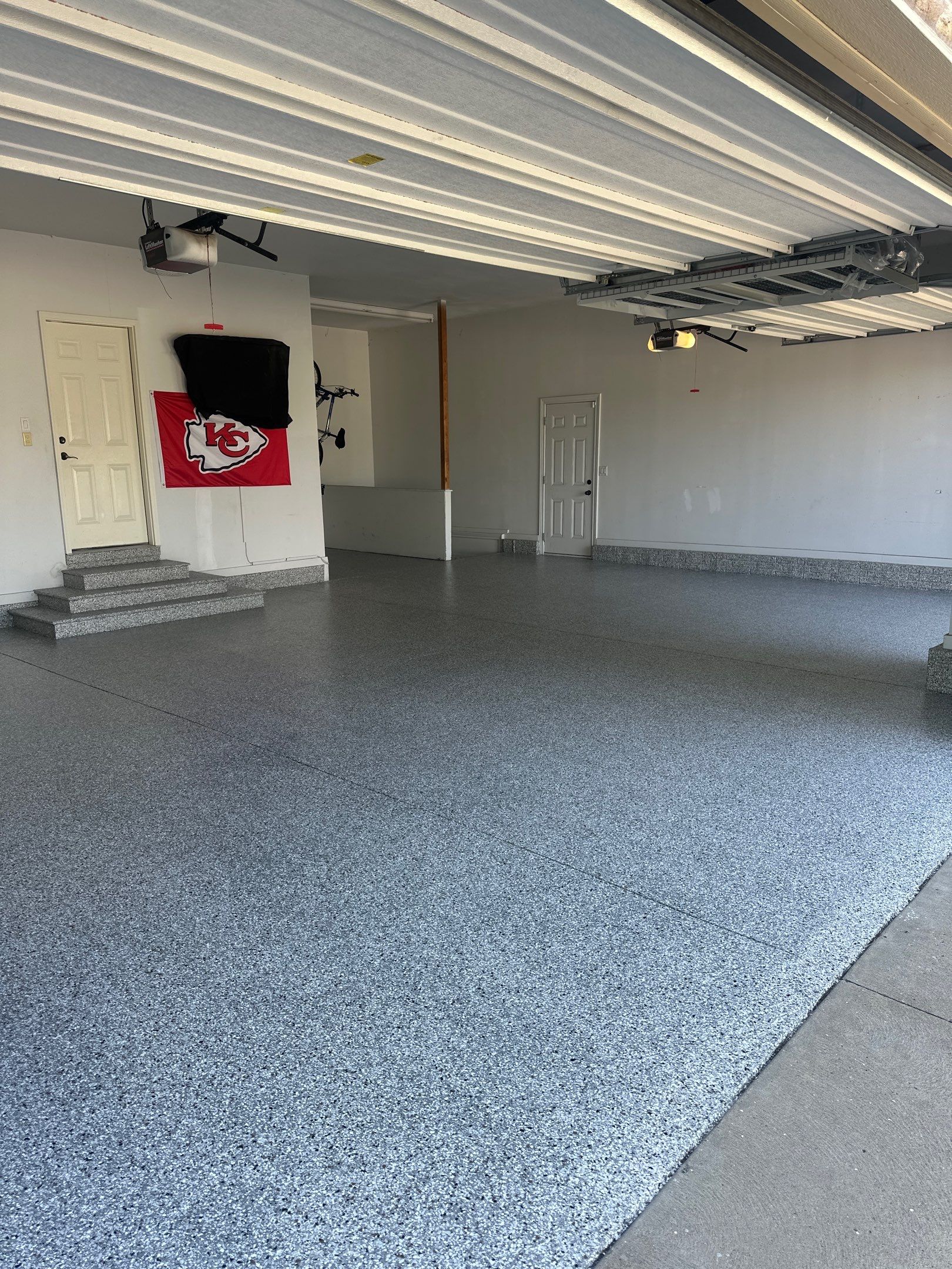 Perfect Garage for Chiefs Gameday ❤️💛 by Revival Concrete Coatings, LLC