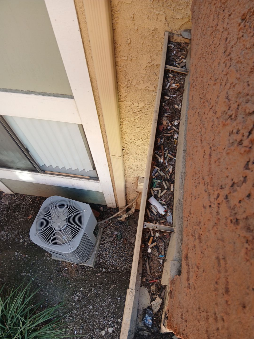 Commercial gutter cleaning Ontario & Rancho Cucamonga, CA before photo with filled gutters