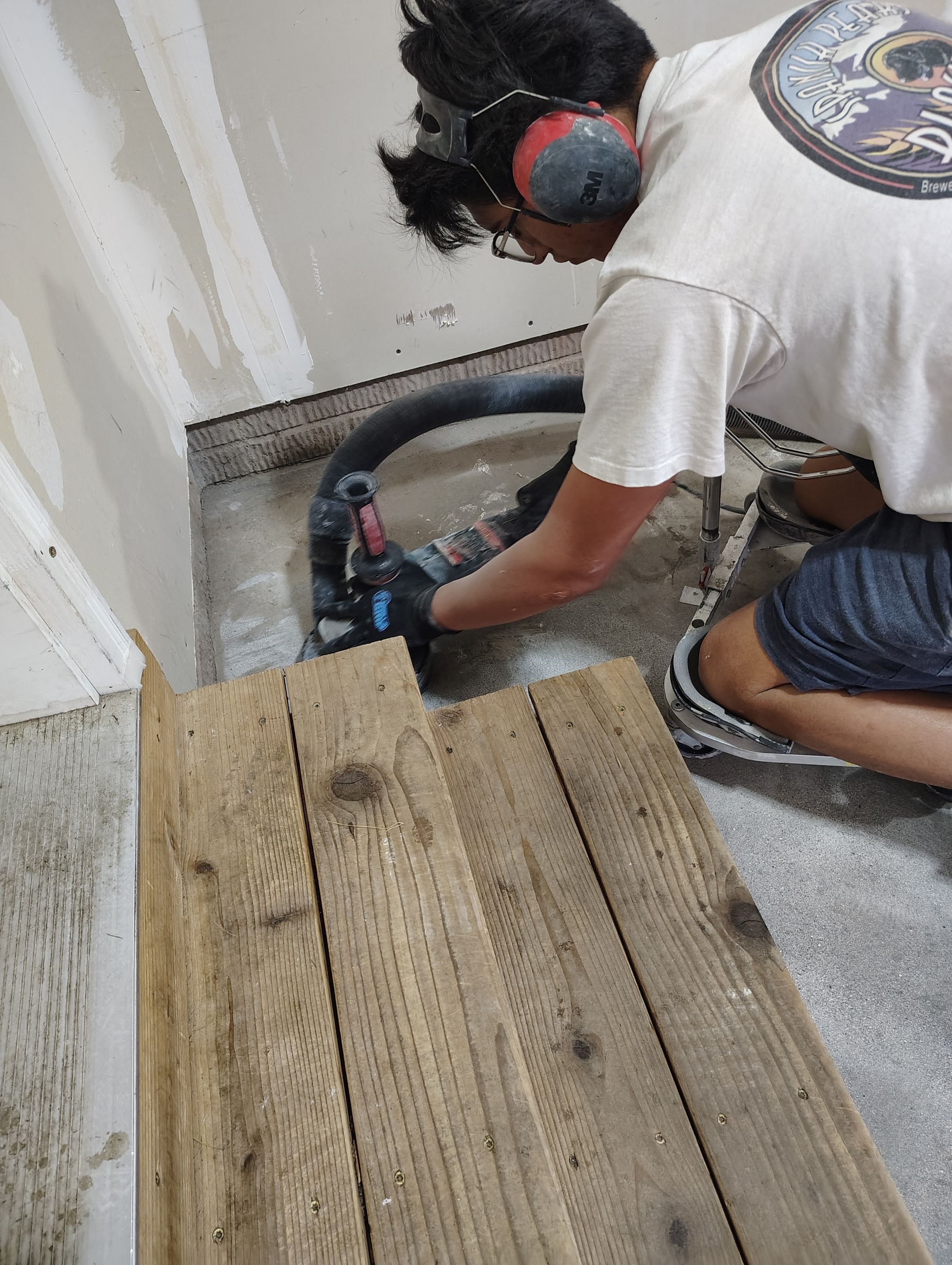 Multi-Car Garage Concrete Coating and Epoxy Finish in Sioux Falls by Select Painting, Coatings & Garage Cabinets