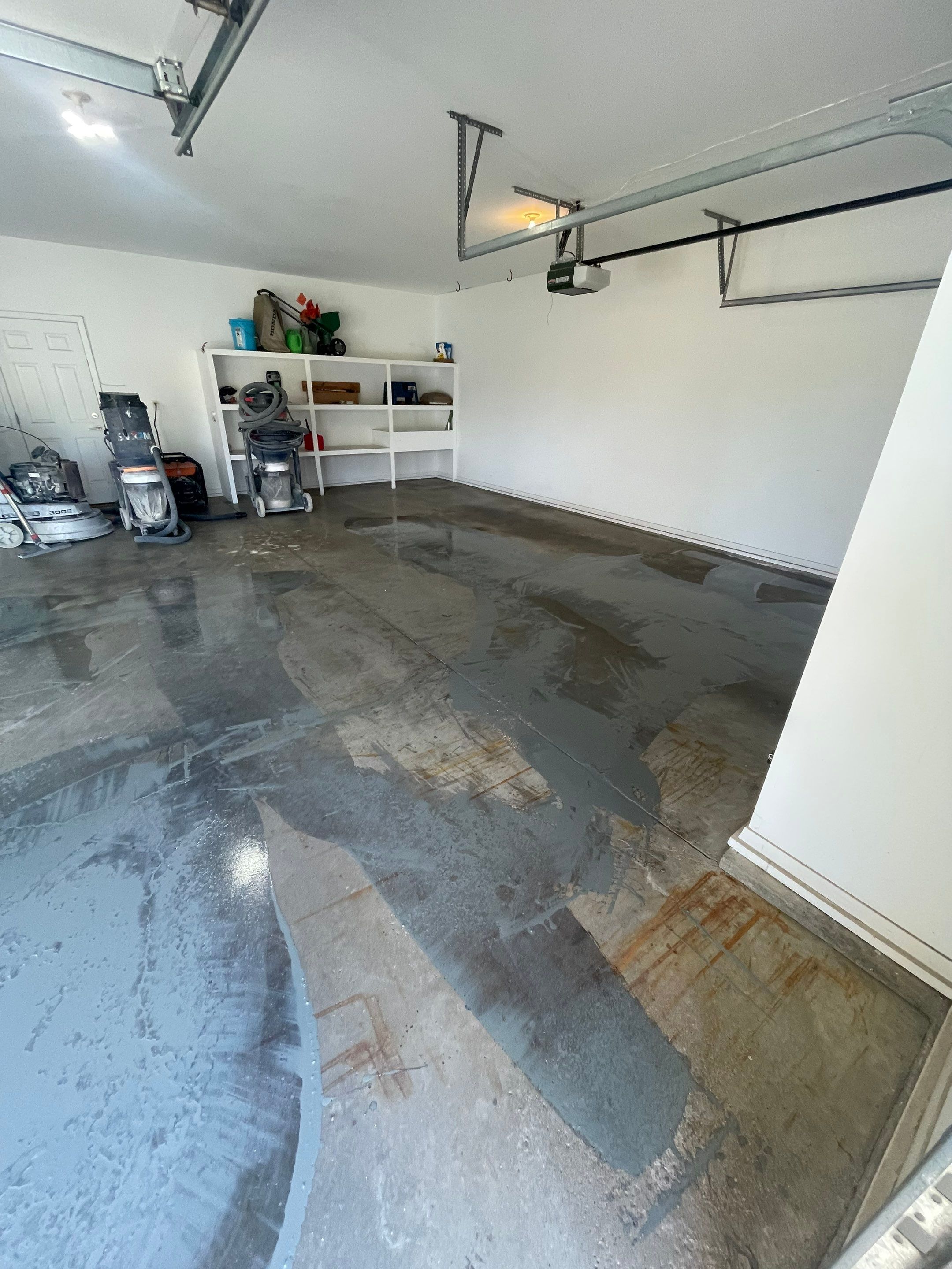 Yankton Garage Floor Restoration with Gray Speckled Epoxy Coating by Select Painting, Coatings & Garage Cabinets
