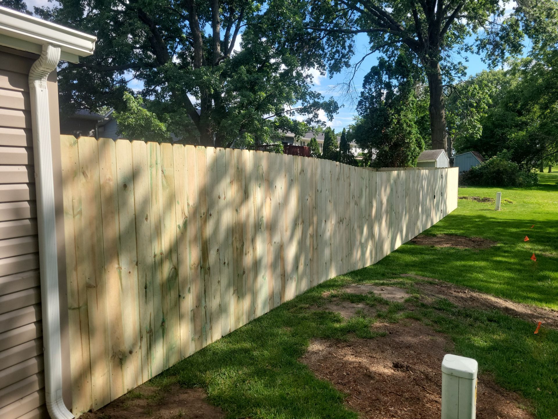 Pressure-Treated Pine Privacy Fence and Custom Gates in Waterloo by Perfect Picket Fence and Stain