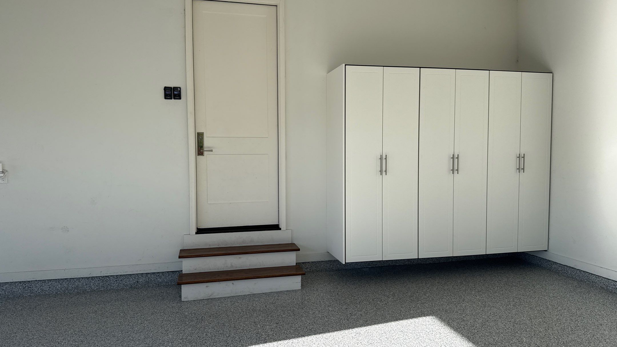 Garage Remodel with Custom Cabinets and Epoxy Floors in Overland Park by Banner Garage