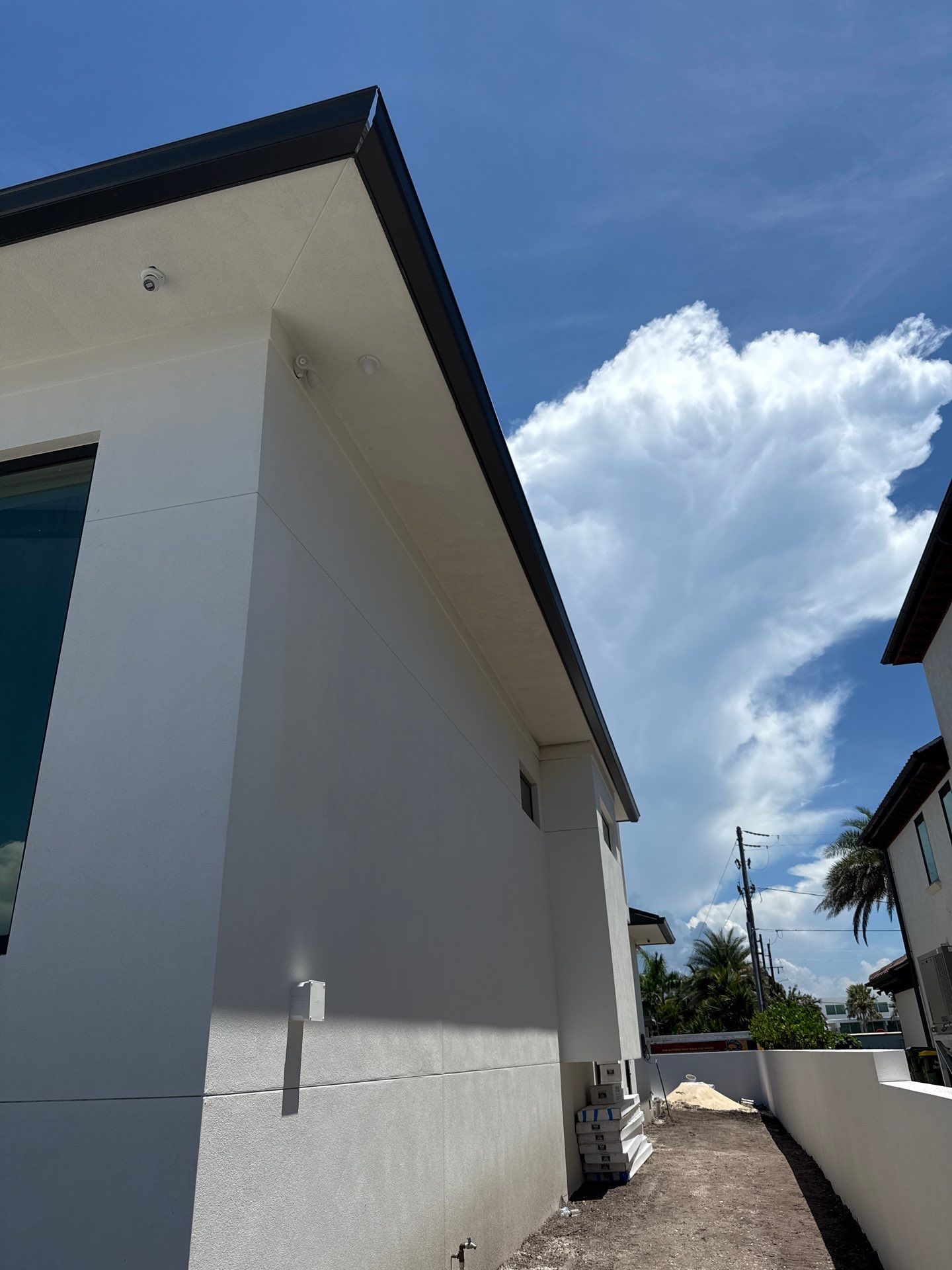 Seamless Aluminum Gutter Installation using black seamless gutters in Sarasota FL by Gutter Professors