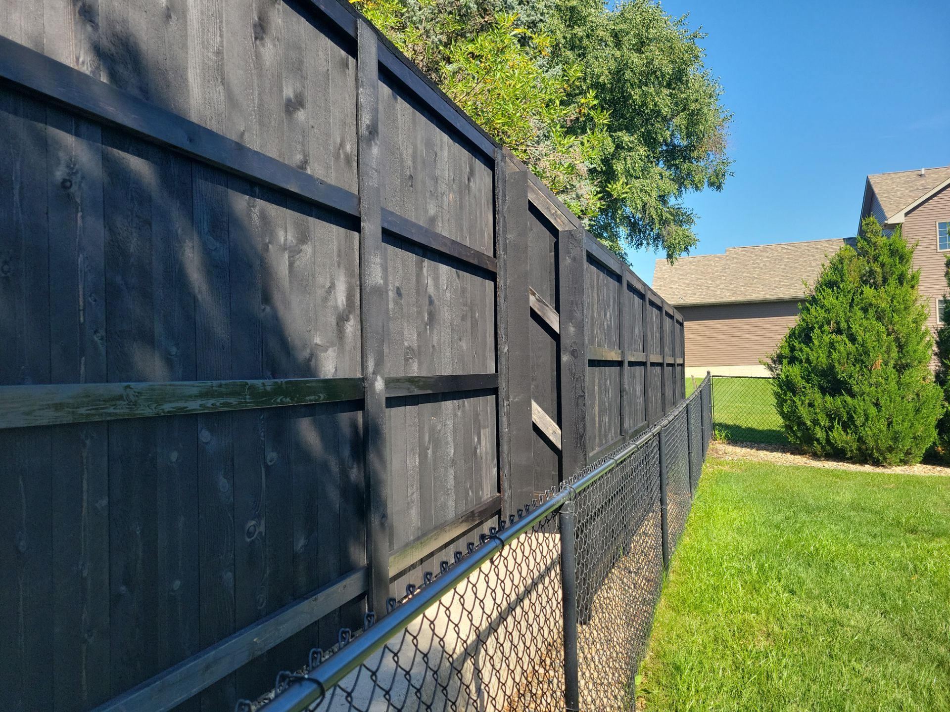 Black Wood Privacy Fence in Cedar Falls by Perfect Picket Fence and Stain
