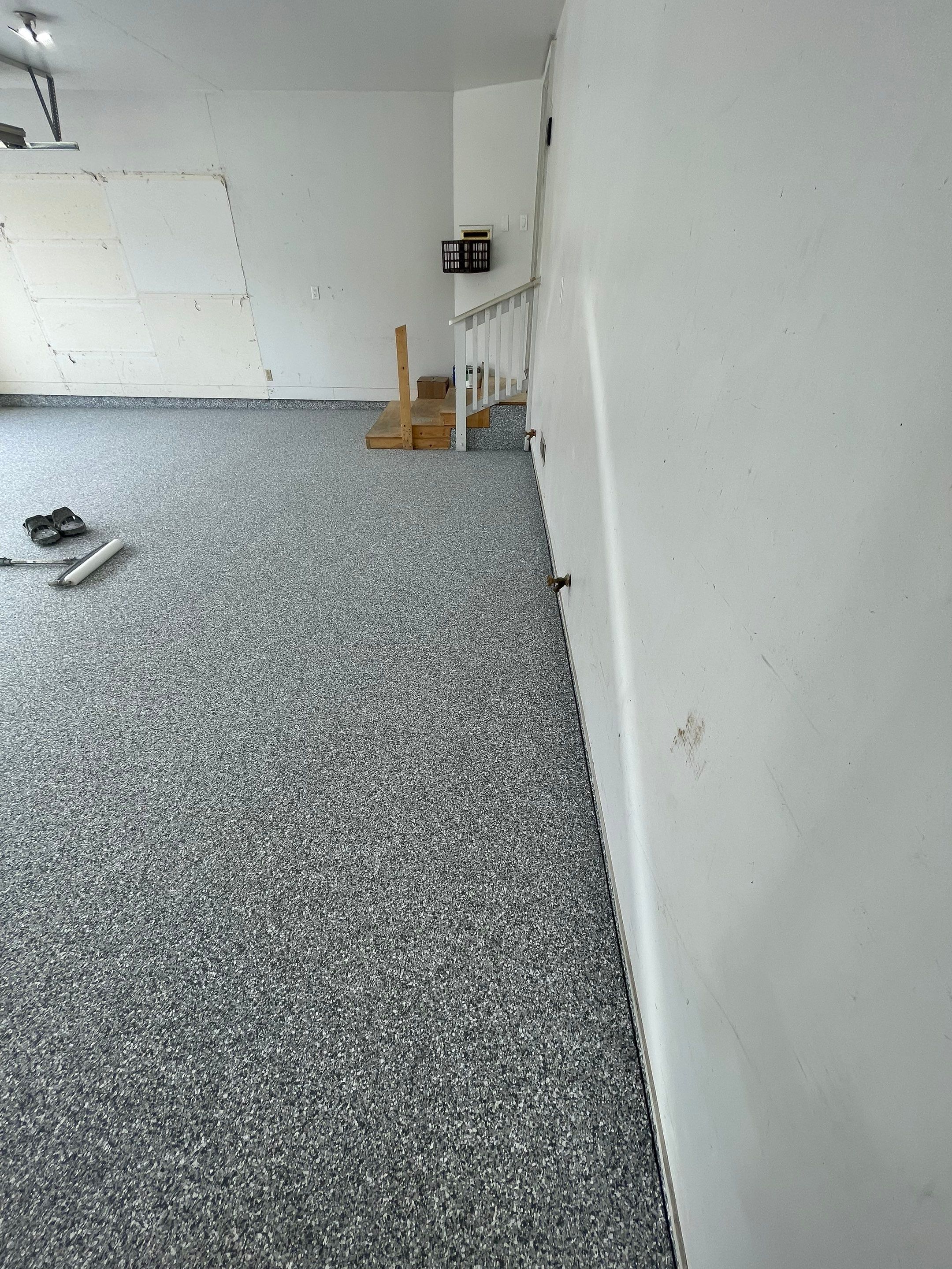 Grey Speckled Concrete Coating for Residential Garage in Yankton by Select Painting, Coatings & Garage Cabinets