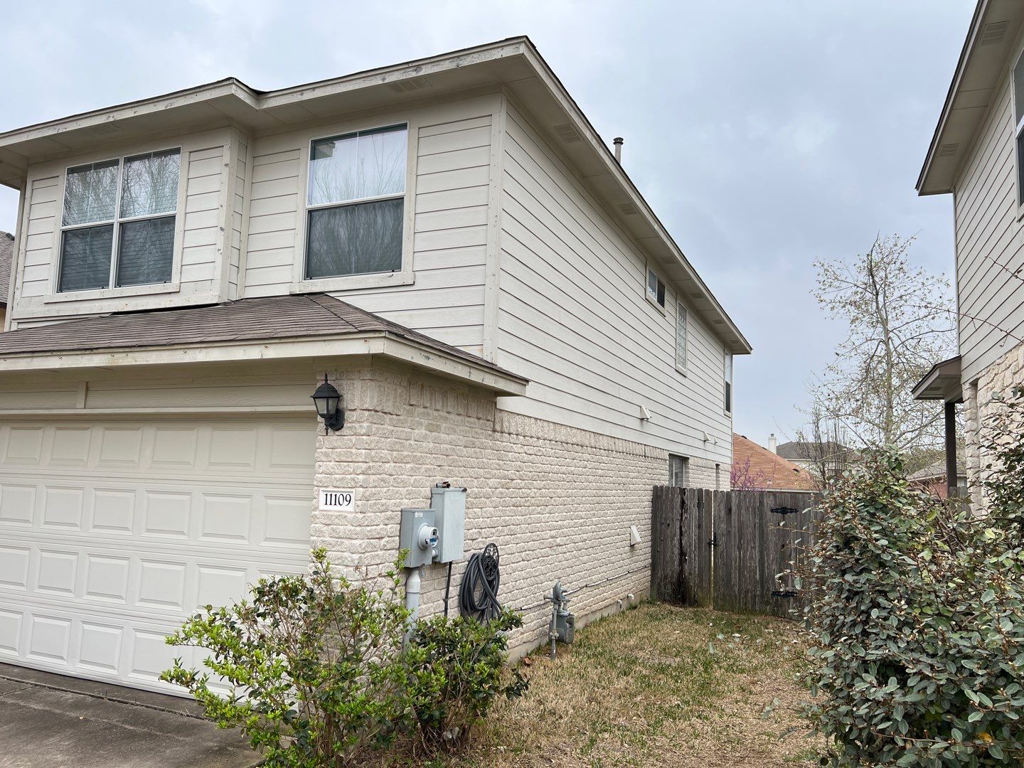 Wind damaged roof replacement by Oakwood Roofing and Construction, LLC