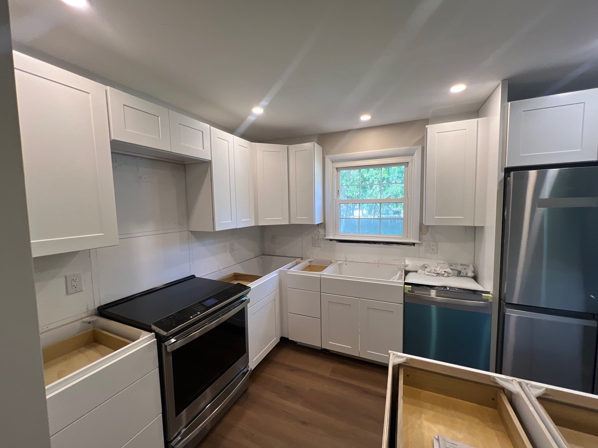Phoenixville Kitchen Remodel with White Shaker Cabinets and Green Backsplash by Reliable General Contracting