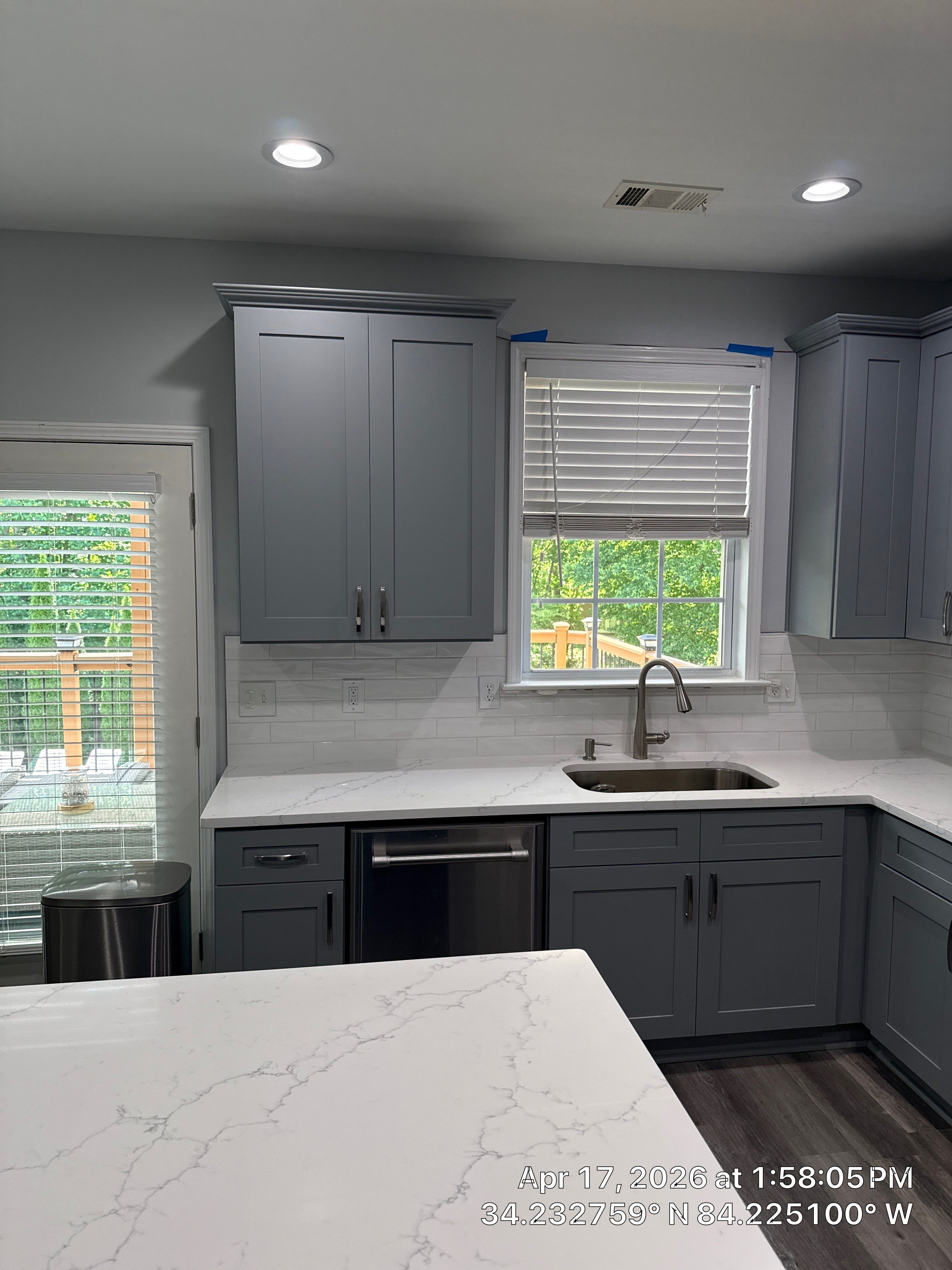 Modern Kitchen Remodel With Grey Shaker Cabinets and Navy Blue Island by Heart & Home Kitchen & Bath Remodeling LLC