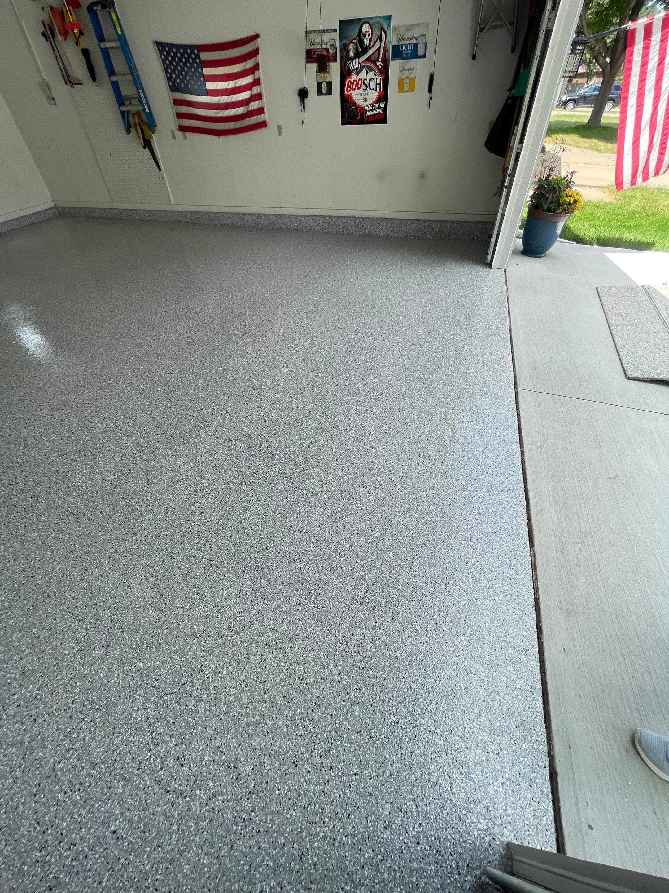 Residential Garage Floor Coating with Feather Grey Finish in Sioux Falls by Select Painting, Coatings & Garage Cabinets