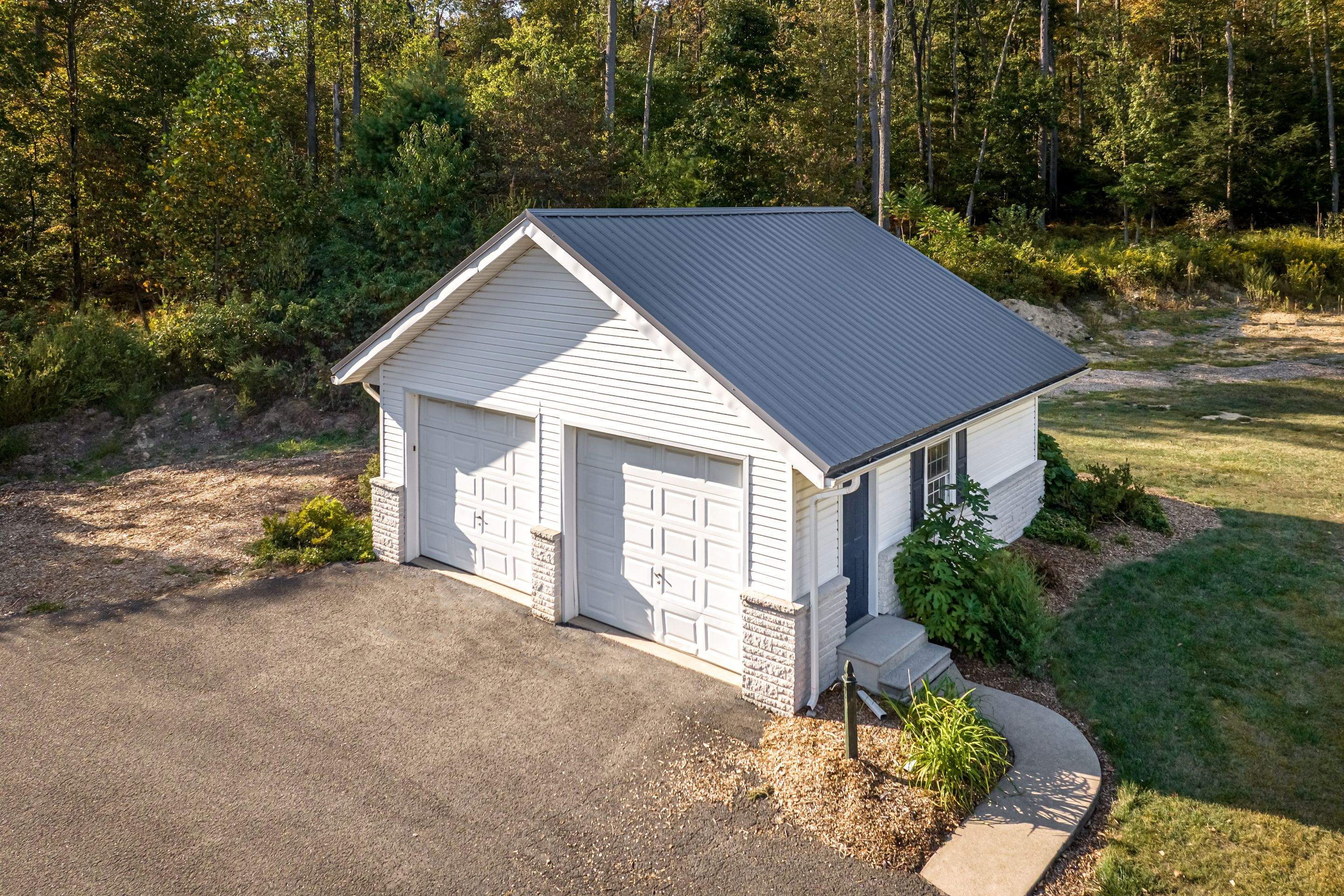 Metal Roof and Gabled Porch Addition in Hegins by Esh Builders