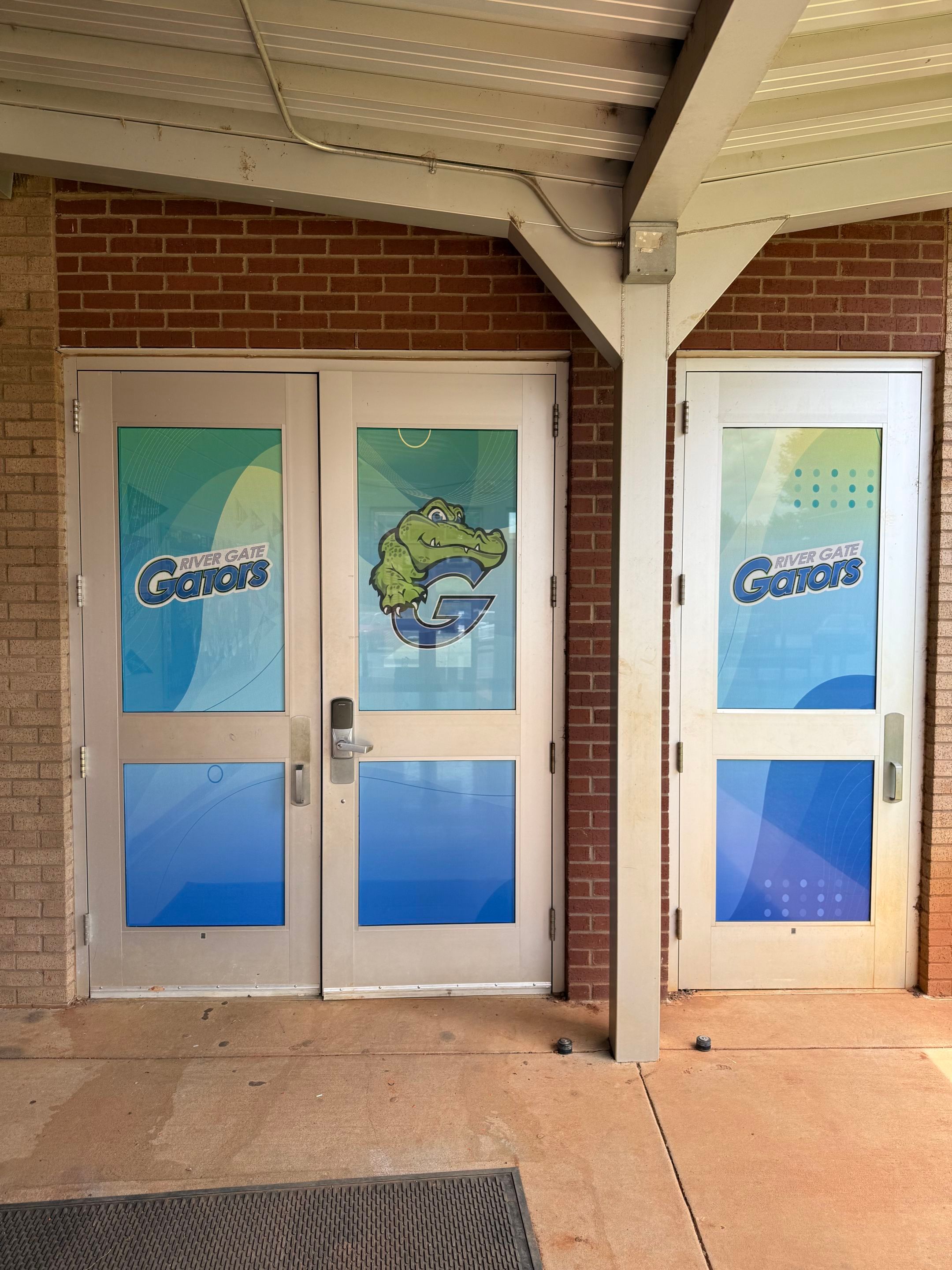 Rivergate Elementary - Window Safety Film Installation with Custom Graphics by QC Signs and Graphics
