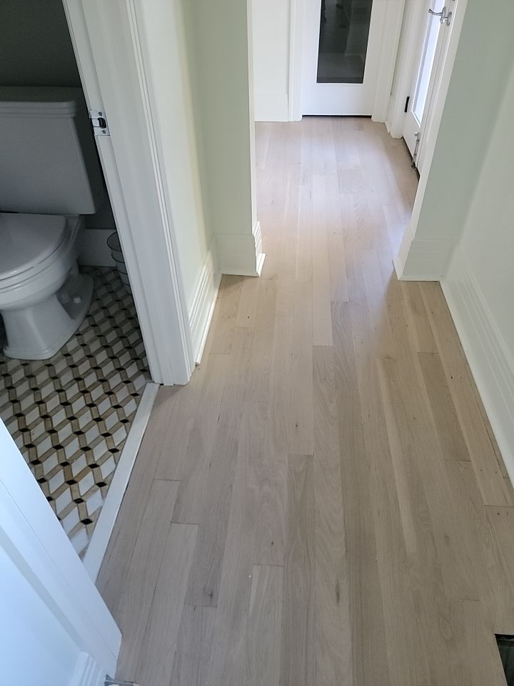 From dark to light, the results are stunning! Beautiful white oak refinish with Country White stain by Footprints Floors of Nashville