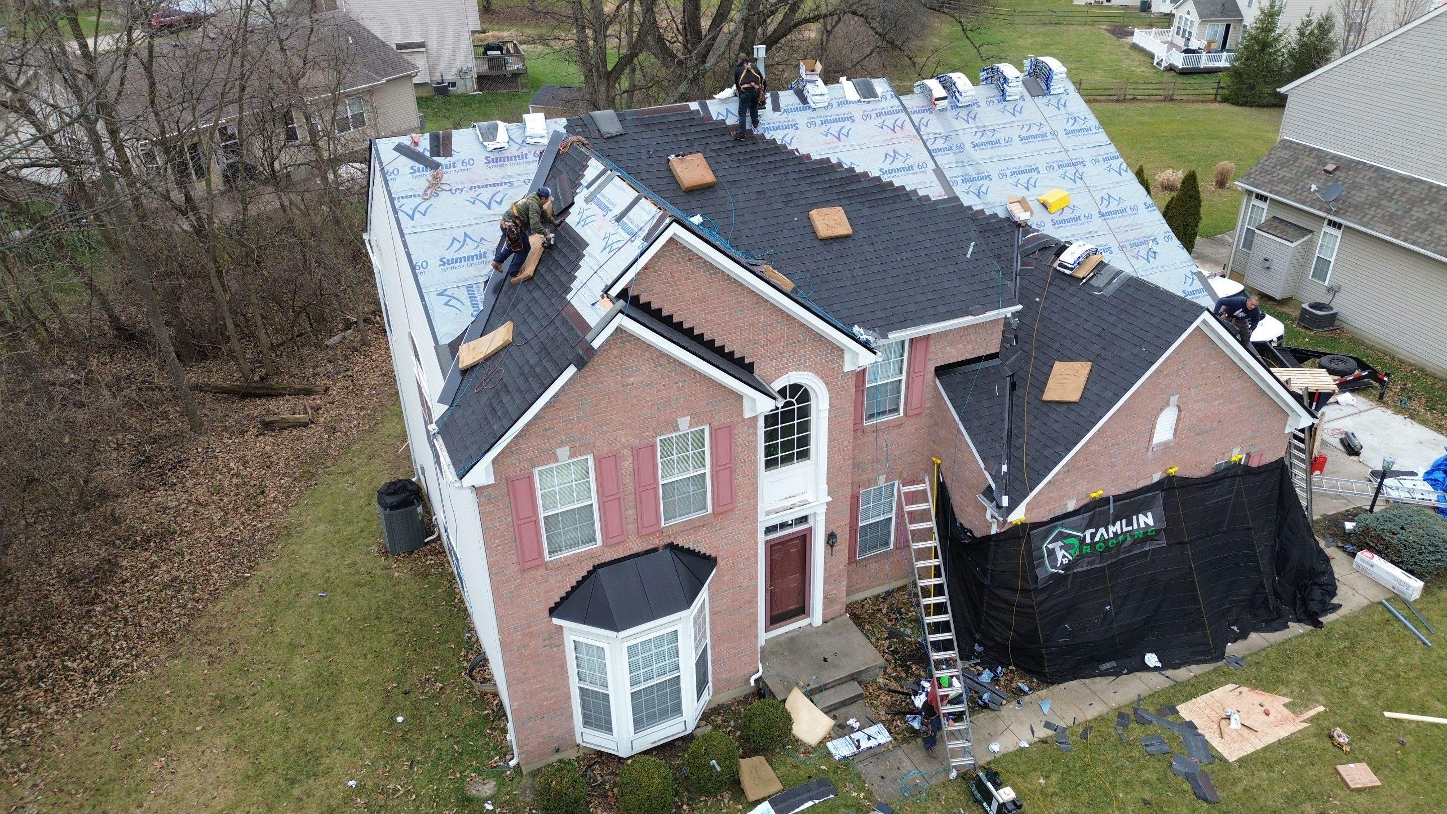 Walden Ponds - Pristine Black and Hydro Flo Gutter Guards by Tamlin Roofing
