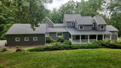 Siding refreshed with Cert. Monogram D/4 x 12'6" clapboard, Smoky Gray and Stone Facade, Coastal Gray