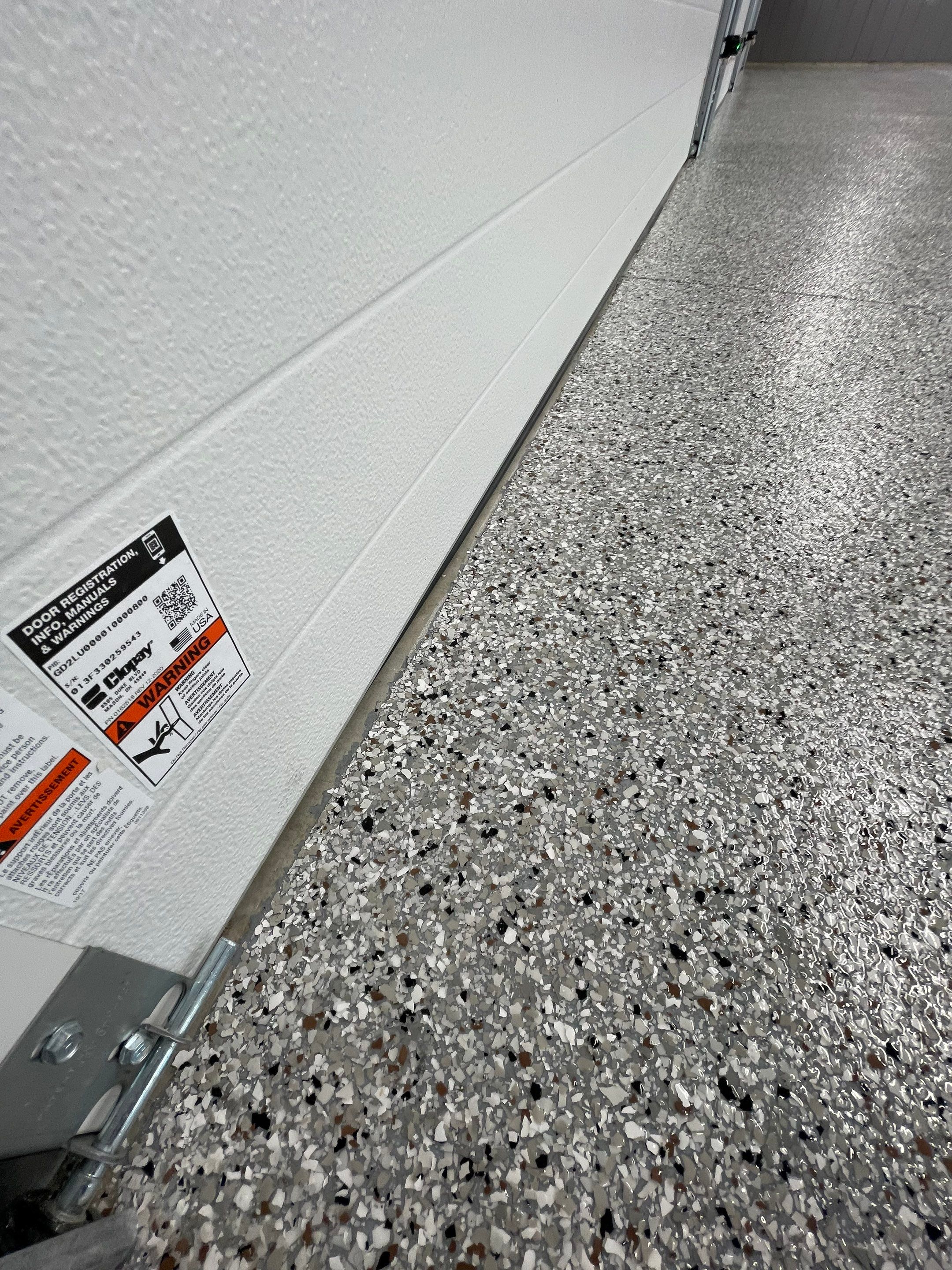 Speckled Epoxy Floor Coating for Large Shop in Rock Valley by Select Painting, Coatings & Garage Cabinets