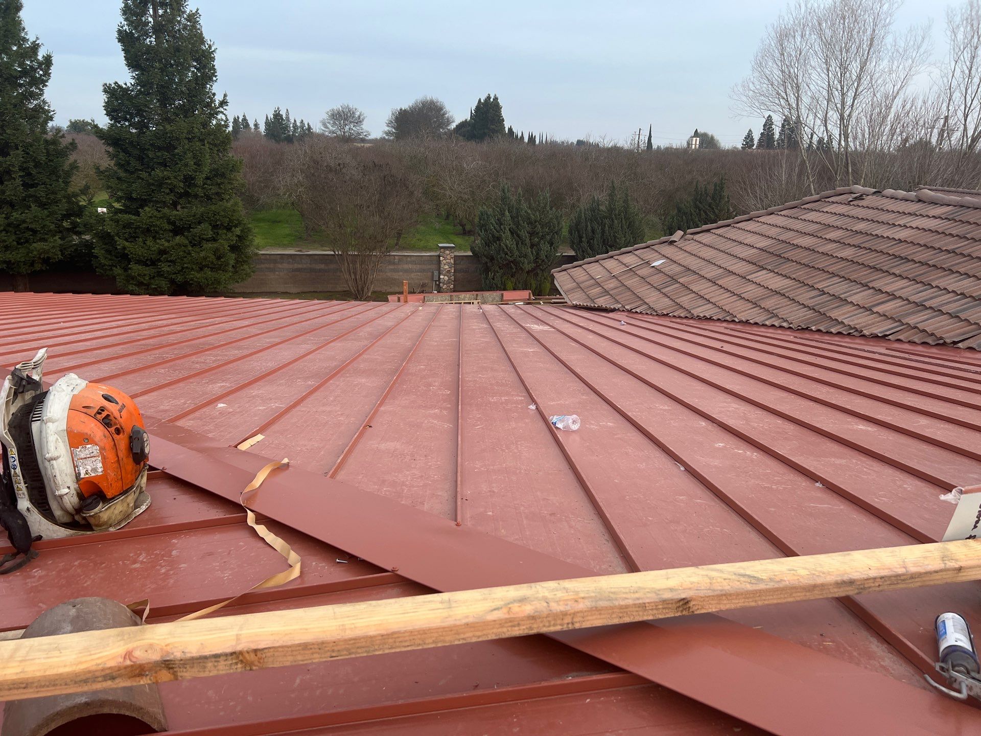 Tile, Metal, and TPO roofing project (new construction) by Straight Edge Roofing Inc