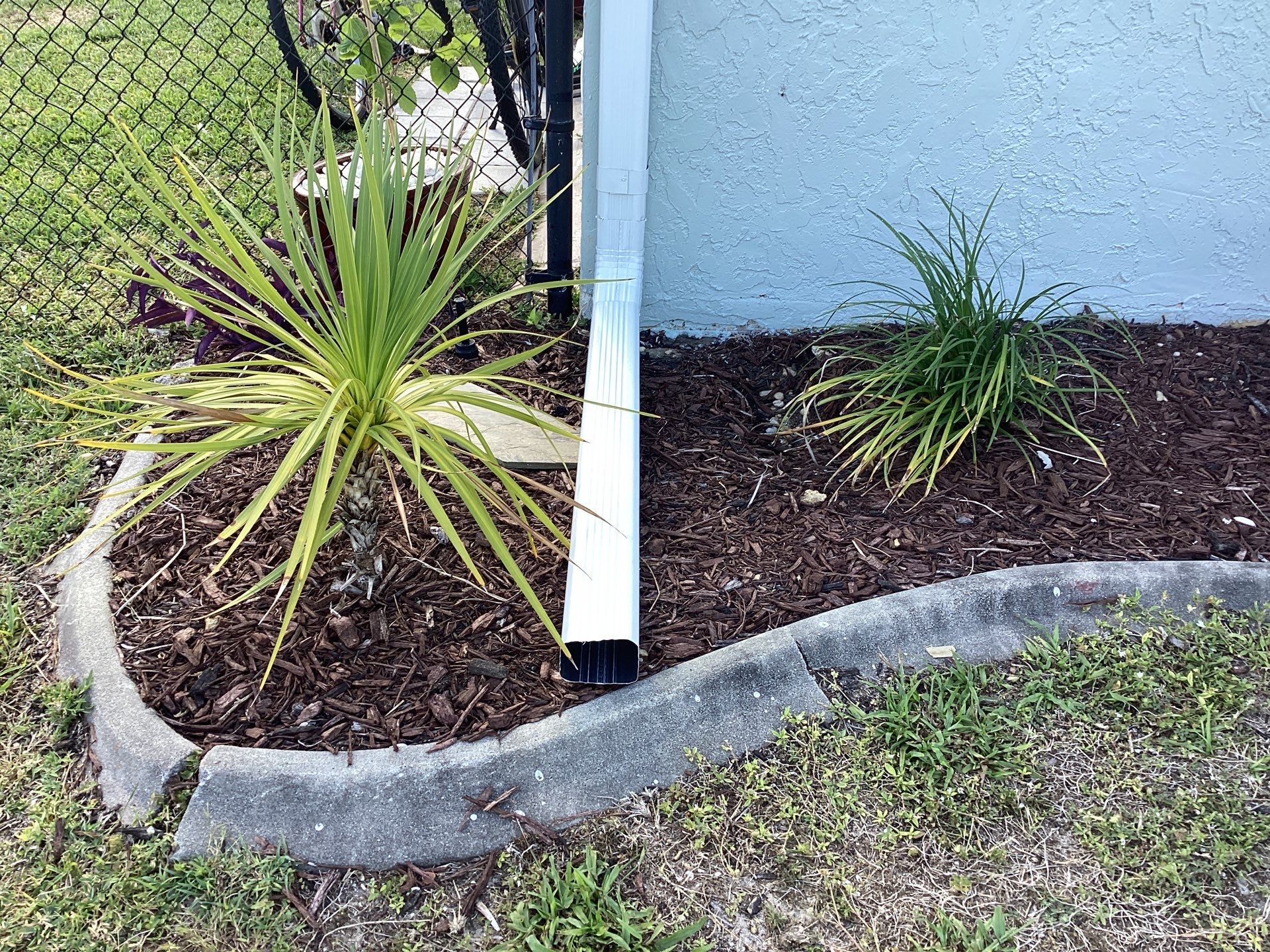 Downspout Installation using 3X4 Elbow Downspout in Cape Coral FL by Gutter Professors