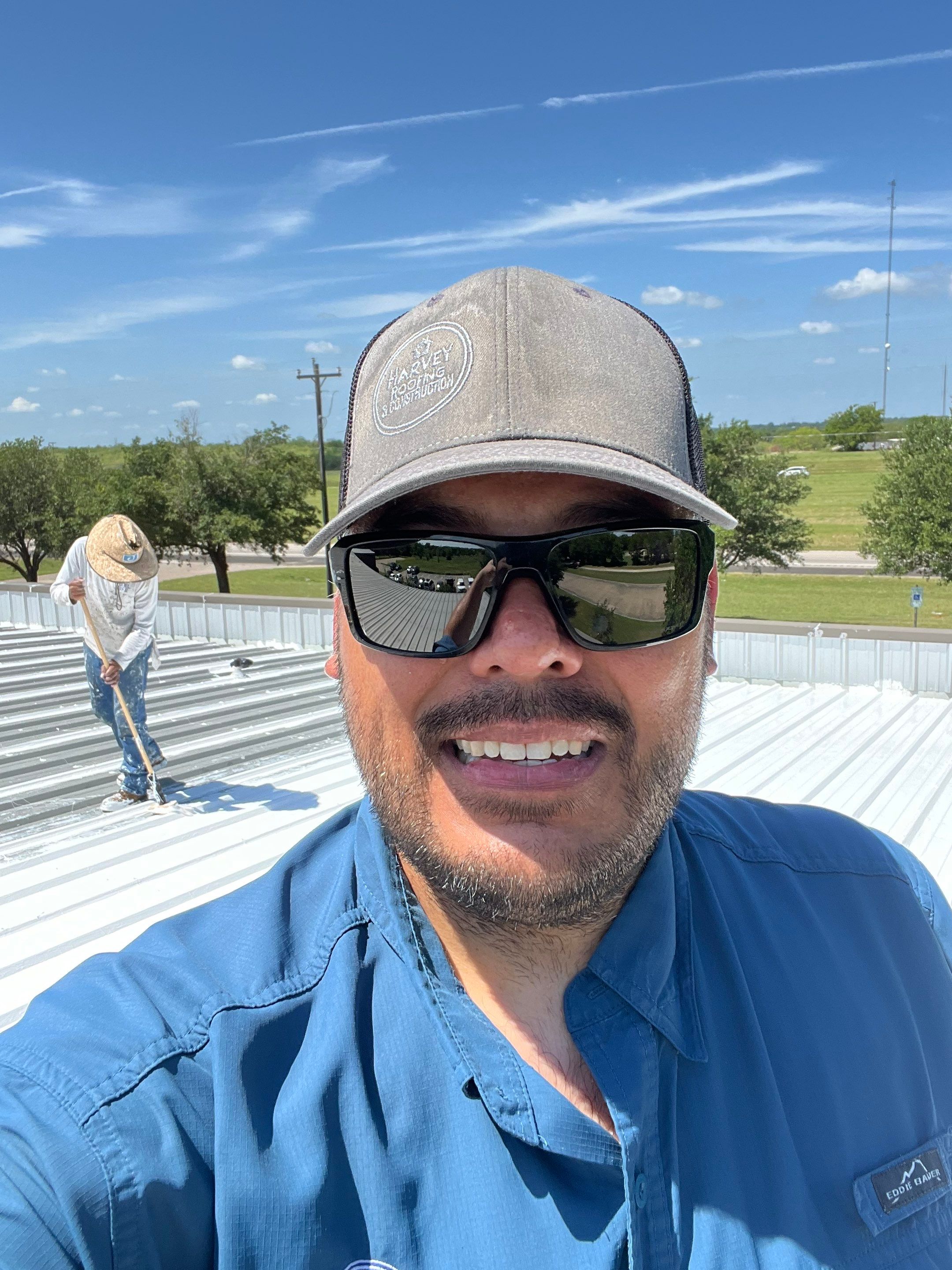 Commercial Roofing Installation using TRP #924 Eterna-Sil Premium Silicone Roof Coating by Harvey Roofing & Construction