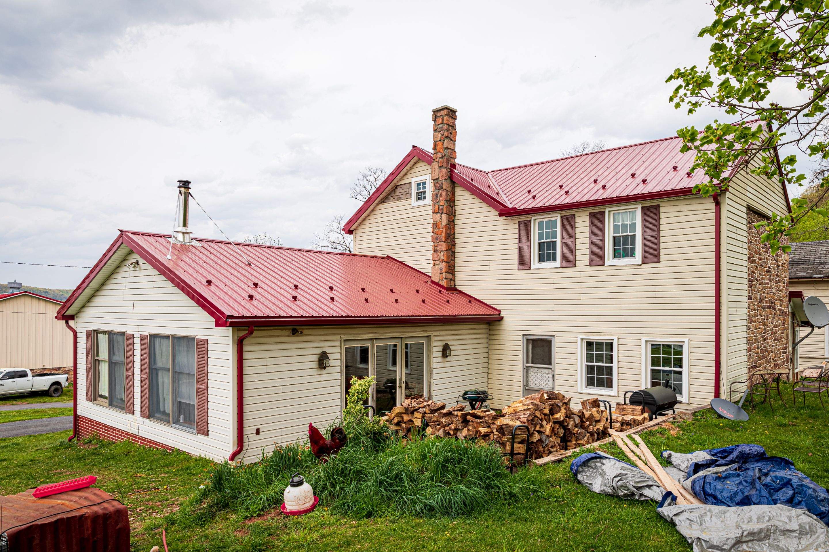 Metal Roof-coloniel red- and new siding by Esh Builders