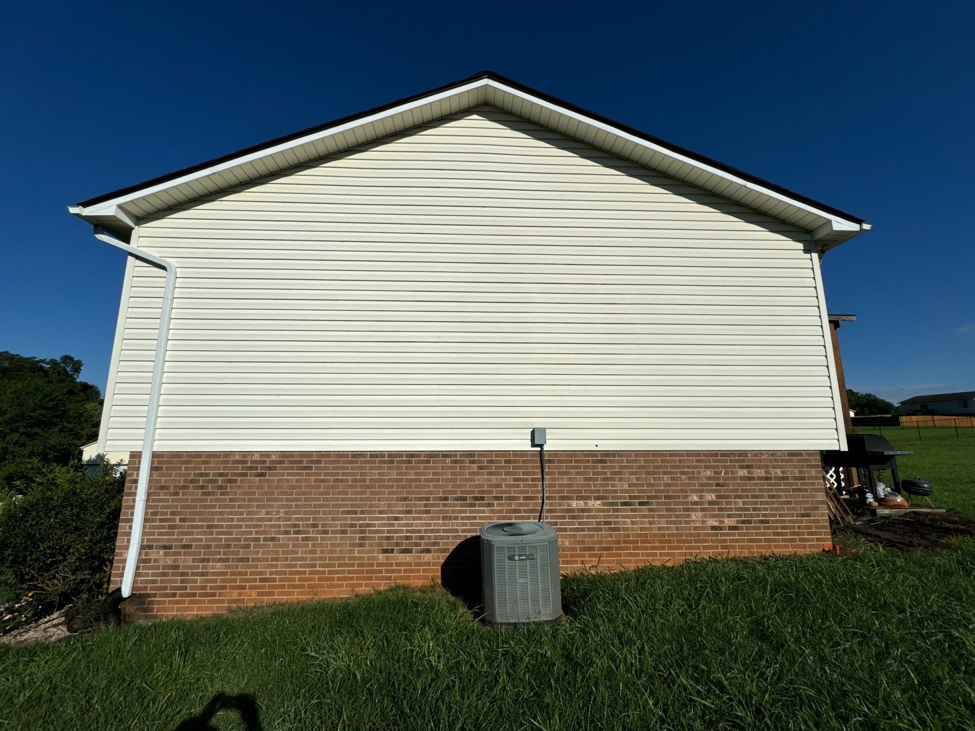 the service being performed is cleaning the vinyl siding and brick of the house to remove dirt and grime