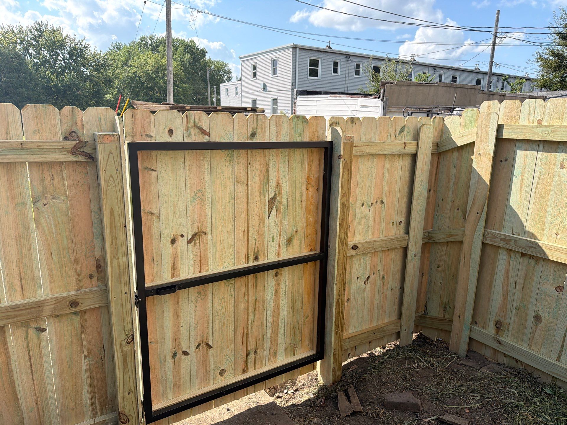 New Treated Wood Privacy Fence and Metal-Framed Gates by Perfect Picket Fence and Stain