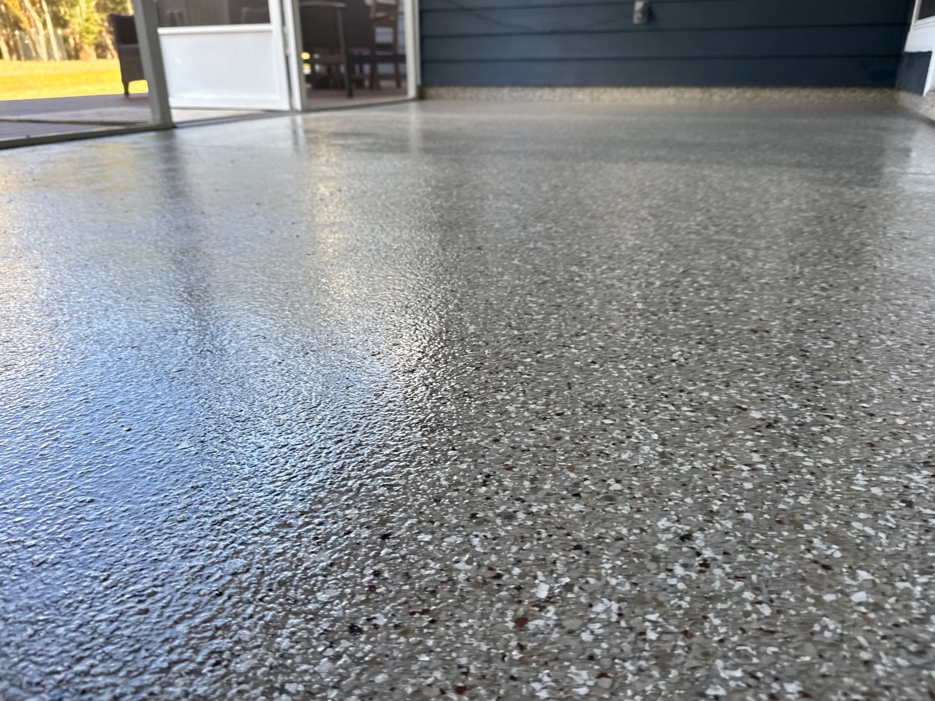 Front and Back Porches in Chiefland, FL in Pebble Beach by Cross Creek Concrete Coatings