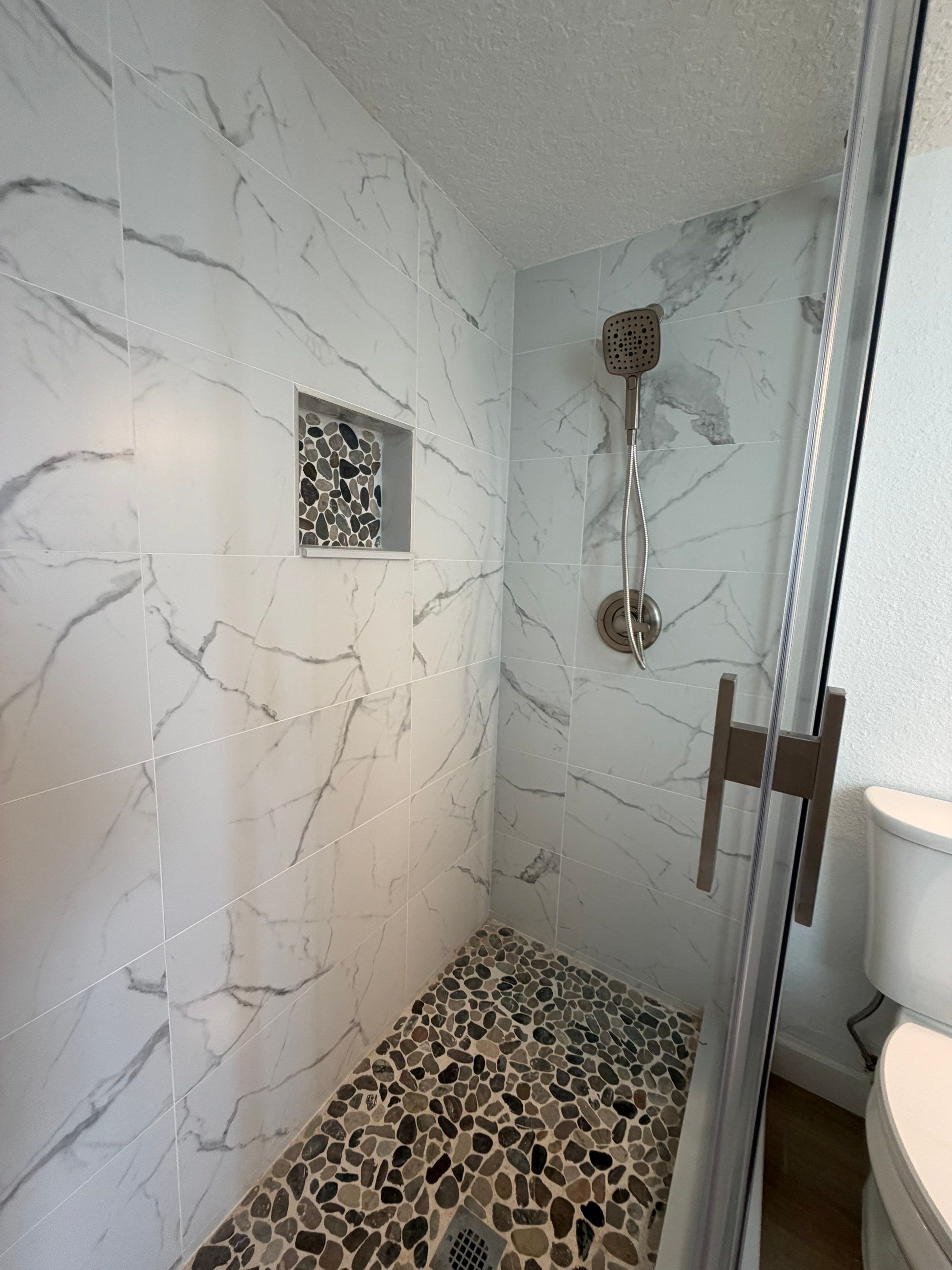 Full Condominium Remodel Featuring Aubrey Oak Flooring In Daytona Beach by Acies Renovations
