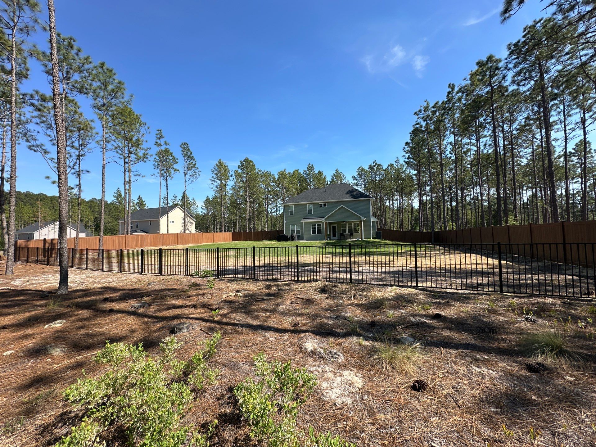Custom Vinyl Privacy and Aluminum Fence Installation in Fayetteville by Superior Fence and Rail
