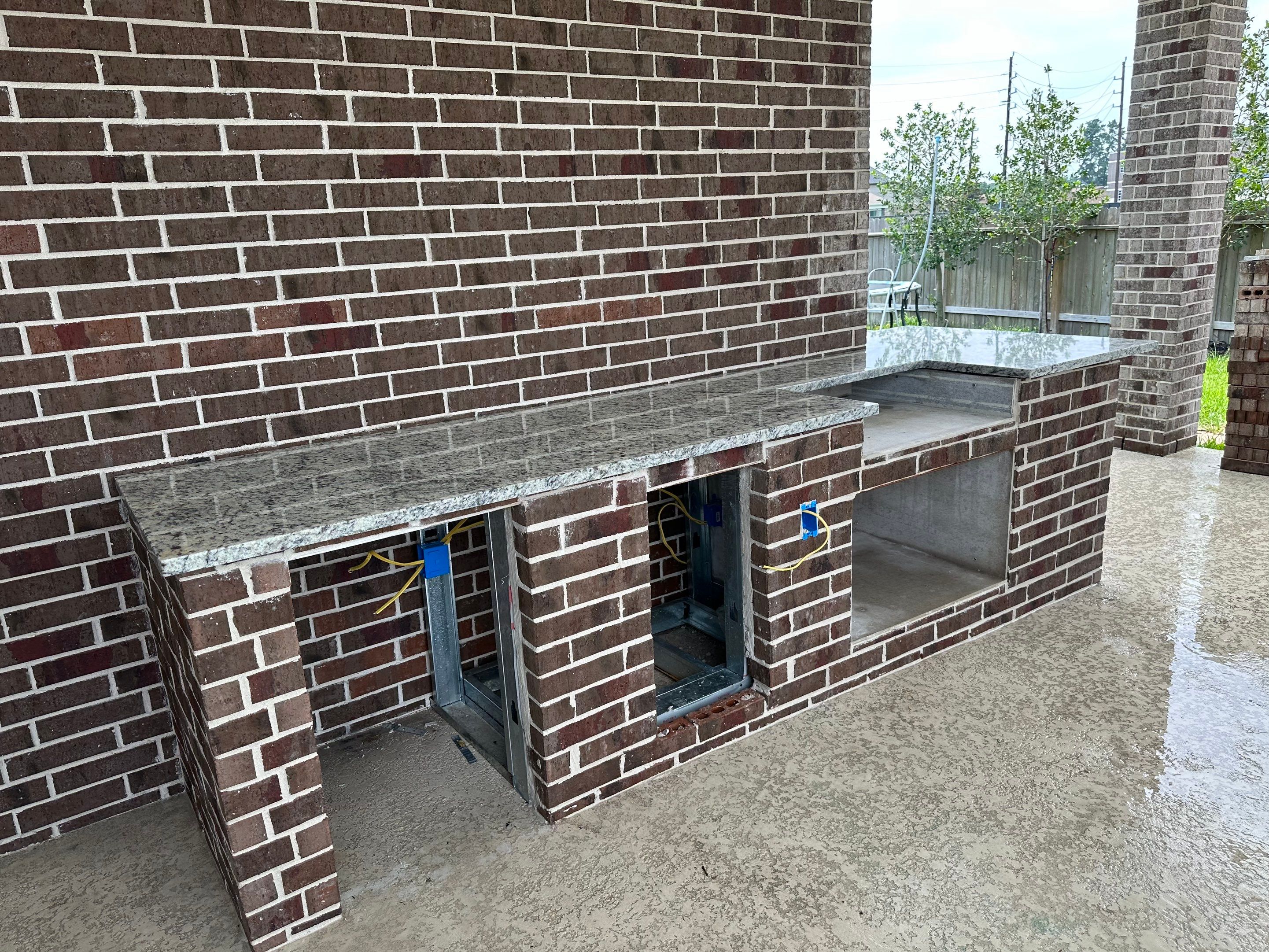 Covered patio and Summer Kitchen in Spring, TX by SophAlx LLC