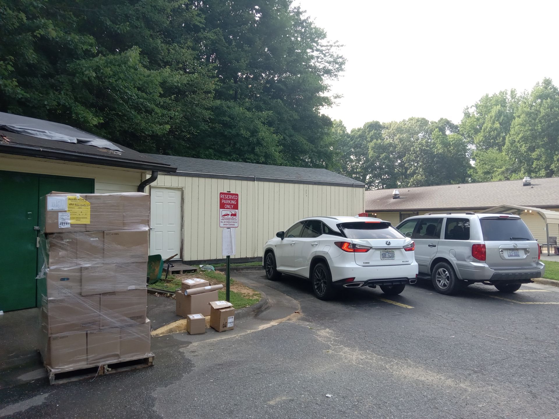 pressure washing the building exterior and concrete parking lot area