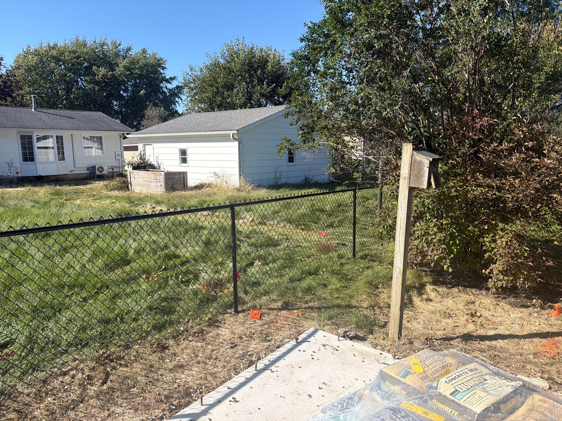 Black Chain Link Fence Installation with Double Gate in Cedar Falls by Perfect Picket Fence and Stain