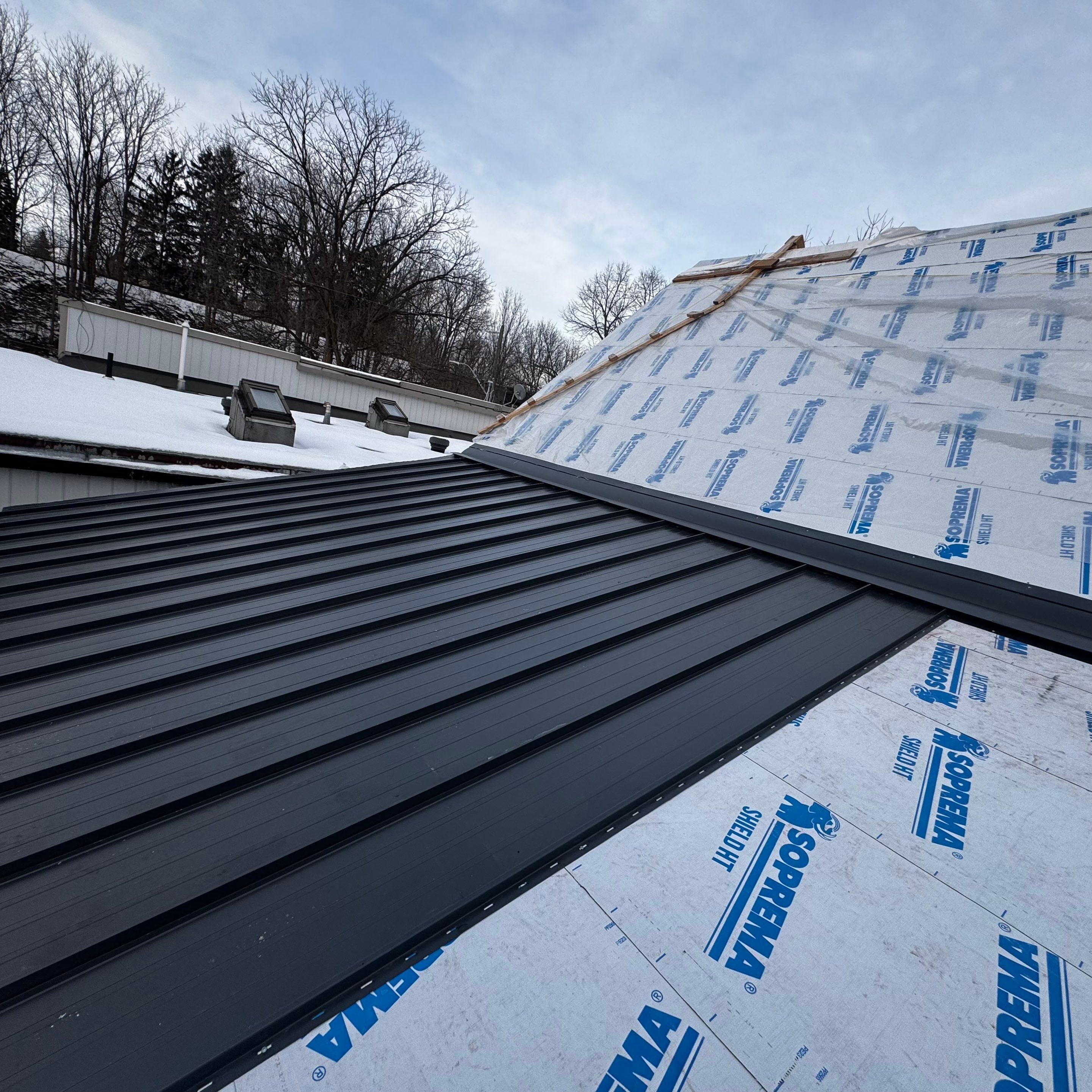 Commercial Roofing Installation using 16" Standing Seam Panels by Jay Carter Roofing & Sheet Metal