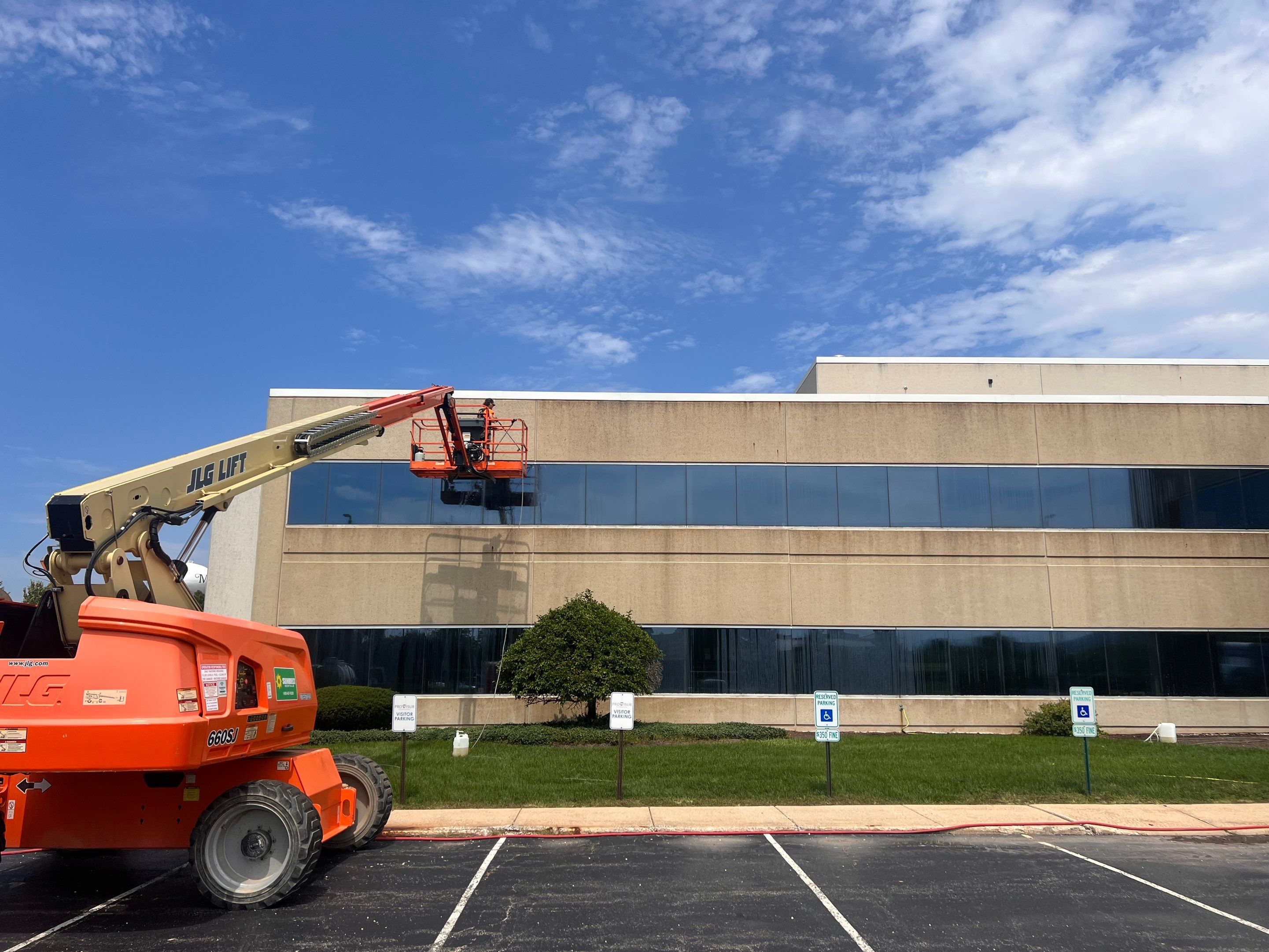 commercial pressure washing using Algaecide, soft wash soap by Northern Power Washing LLC.
