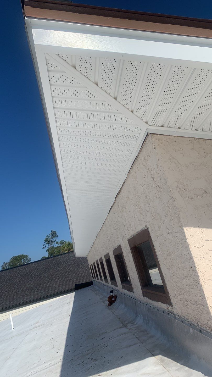 Soffit and Fascia Installation Using White Vinyl Soffit and Musket Brown Fascia by Gutter Professors