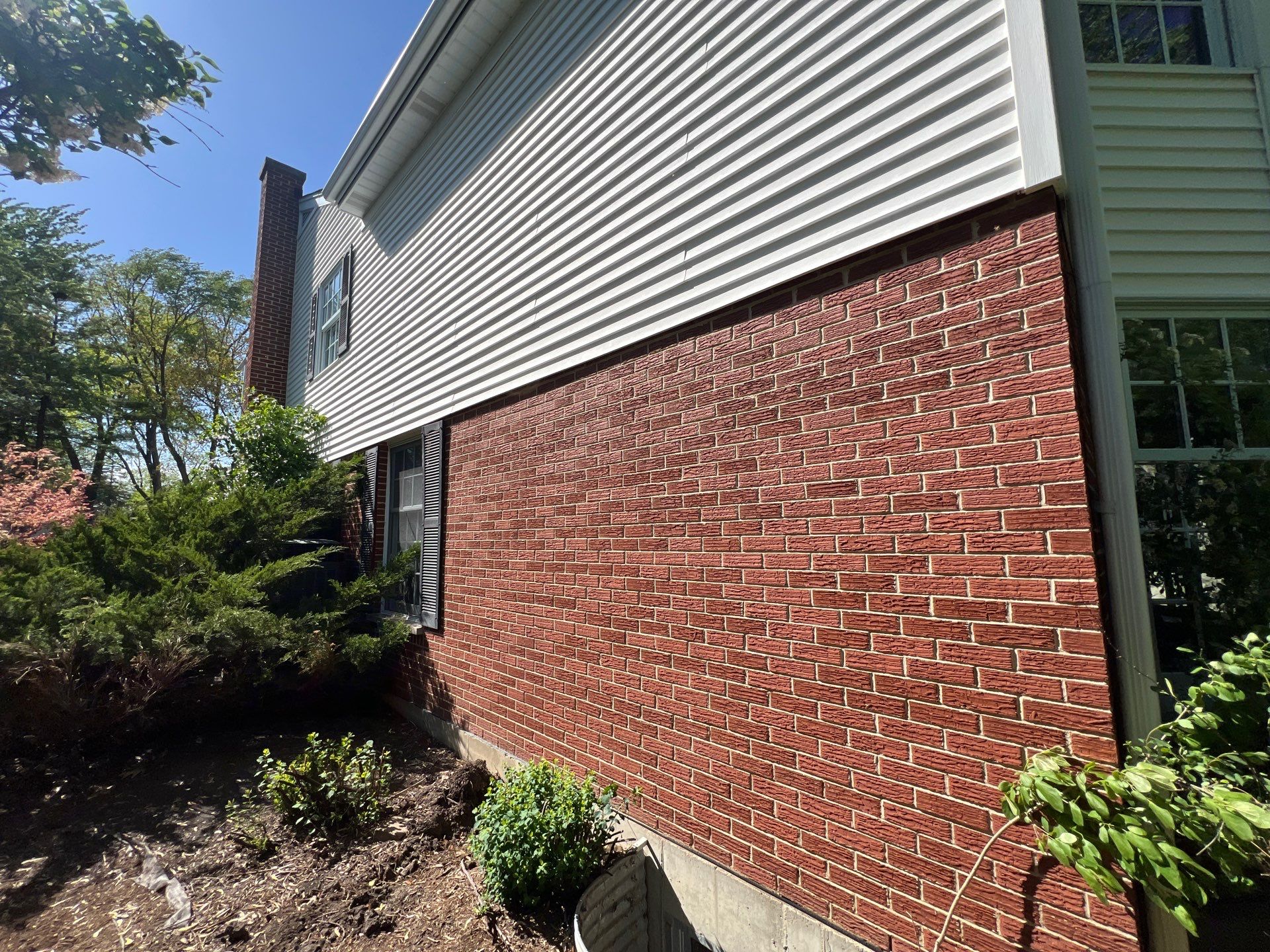 Housewashing  using Algaecide, soft wash soap by Northern Power Washing LLC.
