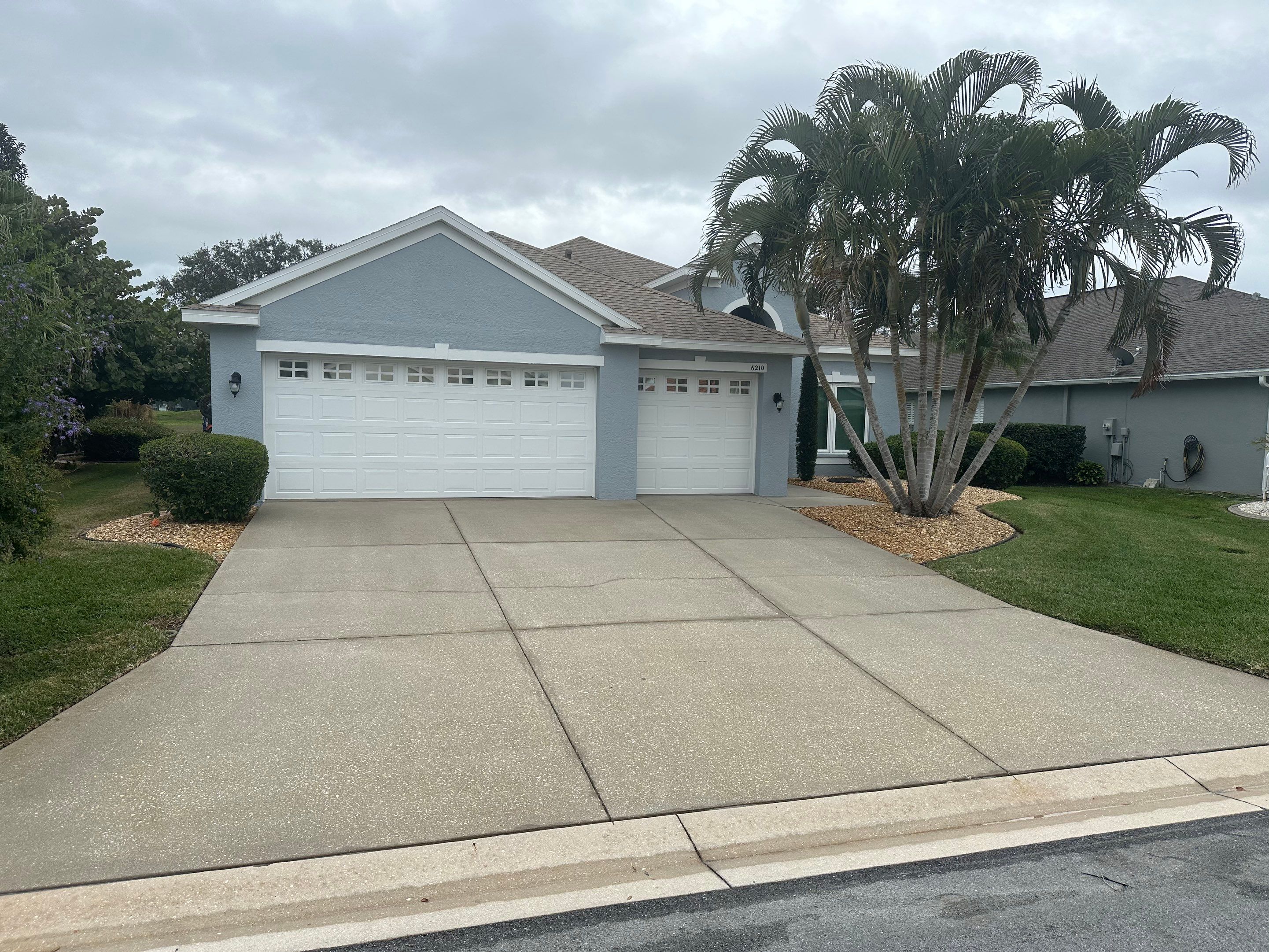 Concrete Driveway, Entryway & Street Curbing Cleaning in Fairways at Imperial Lakes, Palmetto, FL | Sunshine AquaWash by Sunshine AquaWash