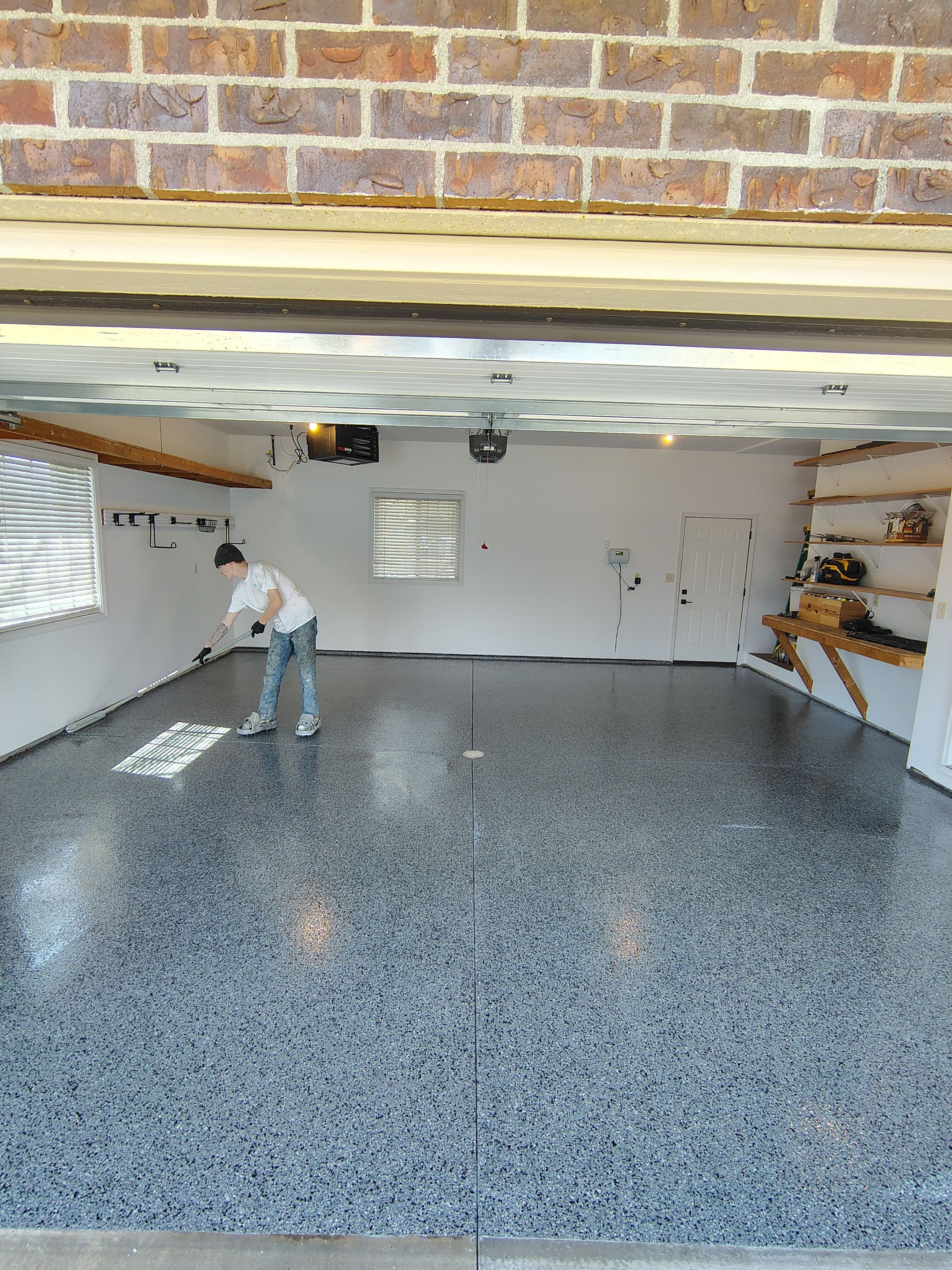Grey Speckled Epoxy Garage Floor Coating in Sioux Falls by Select Painting, Coatings & Garage Cabinets
