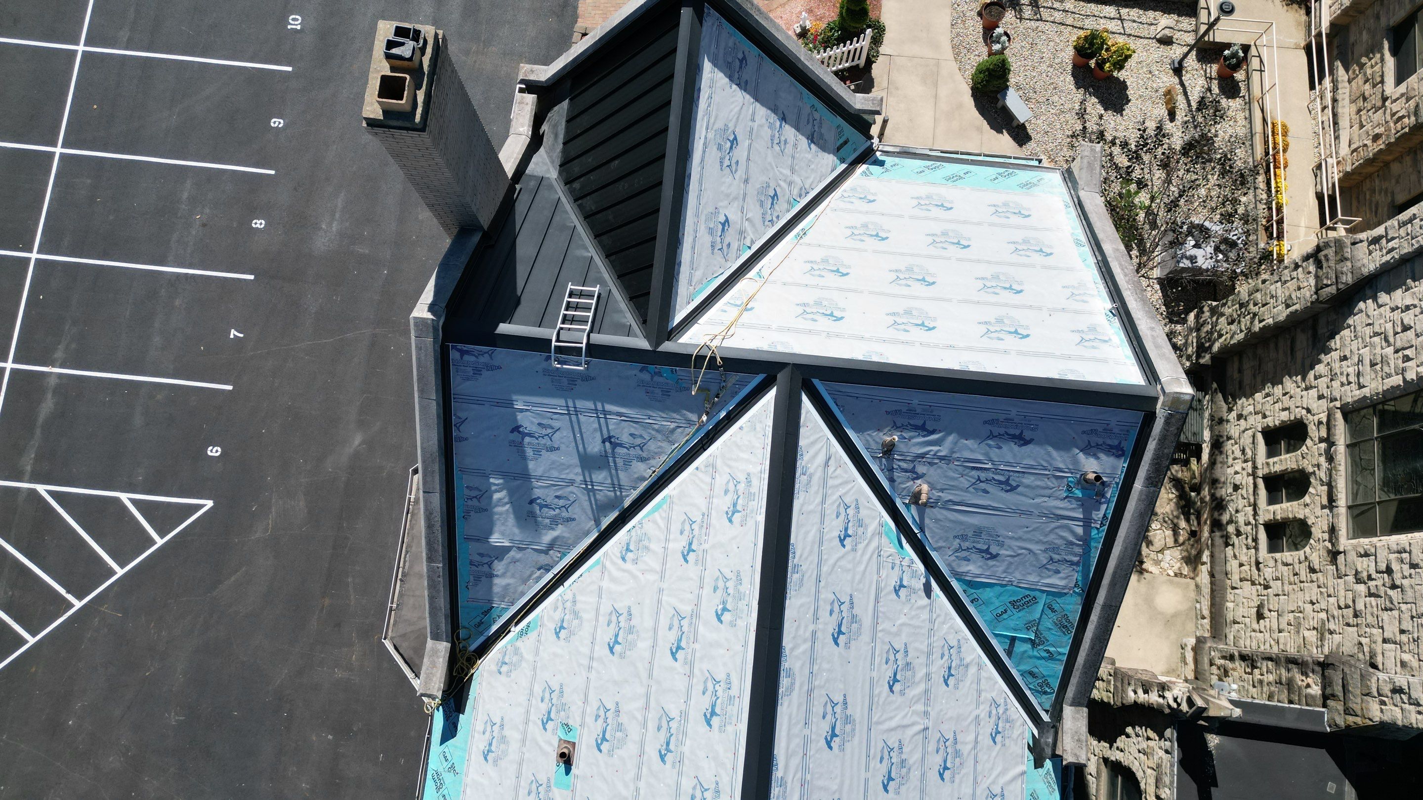 Commercial Roofing Installation using Standing Seam Metal - Frost Black by RoofX 