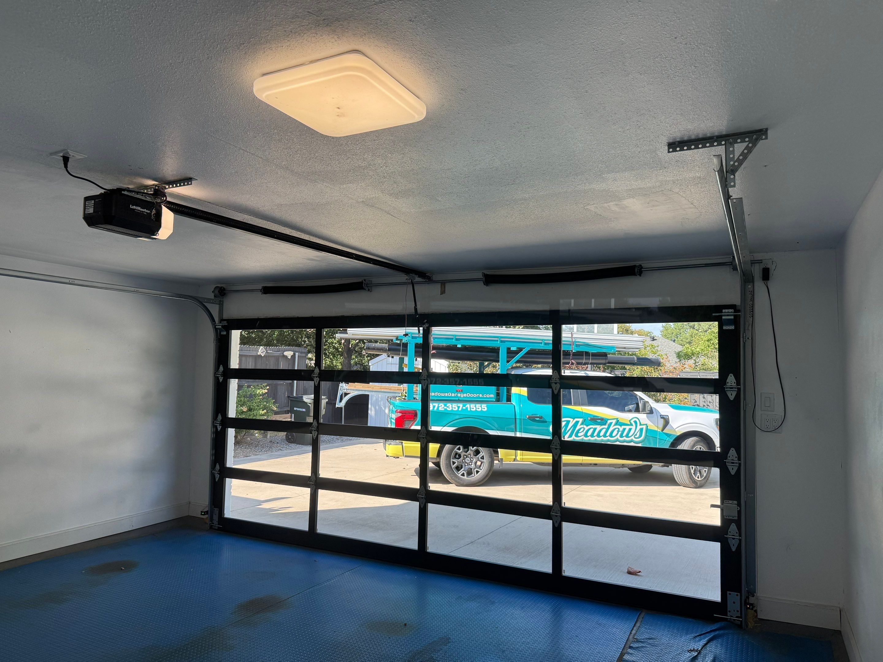 Modern Alumadoor Full View Glass Garage Door Installation in Plano by Meadows Garage Doors
