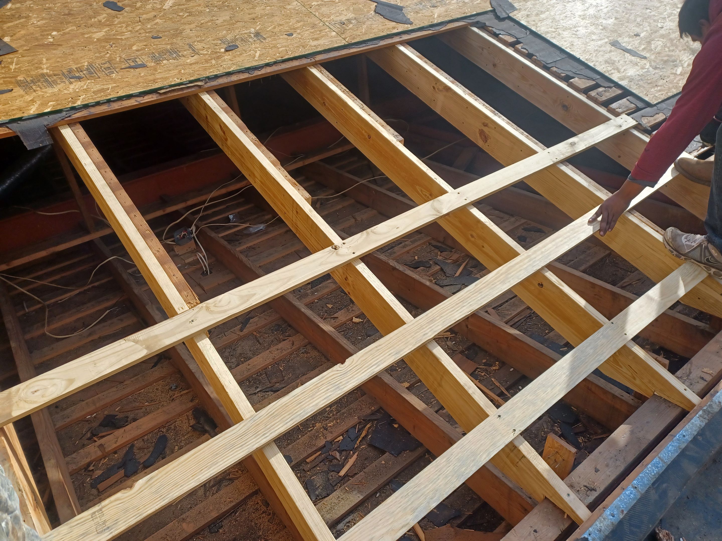 Residential Roofing Installation using PVC membrane and 24 gauge Standing Seam Metal by Hostetler Roofing