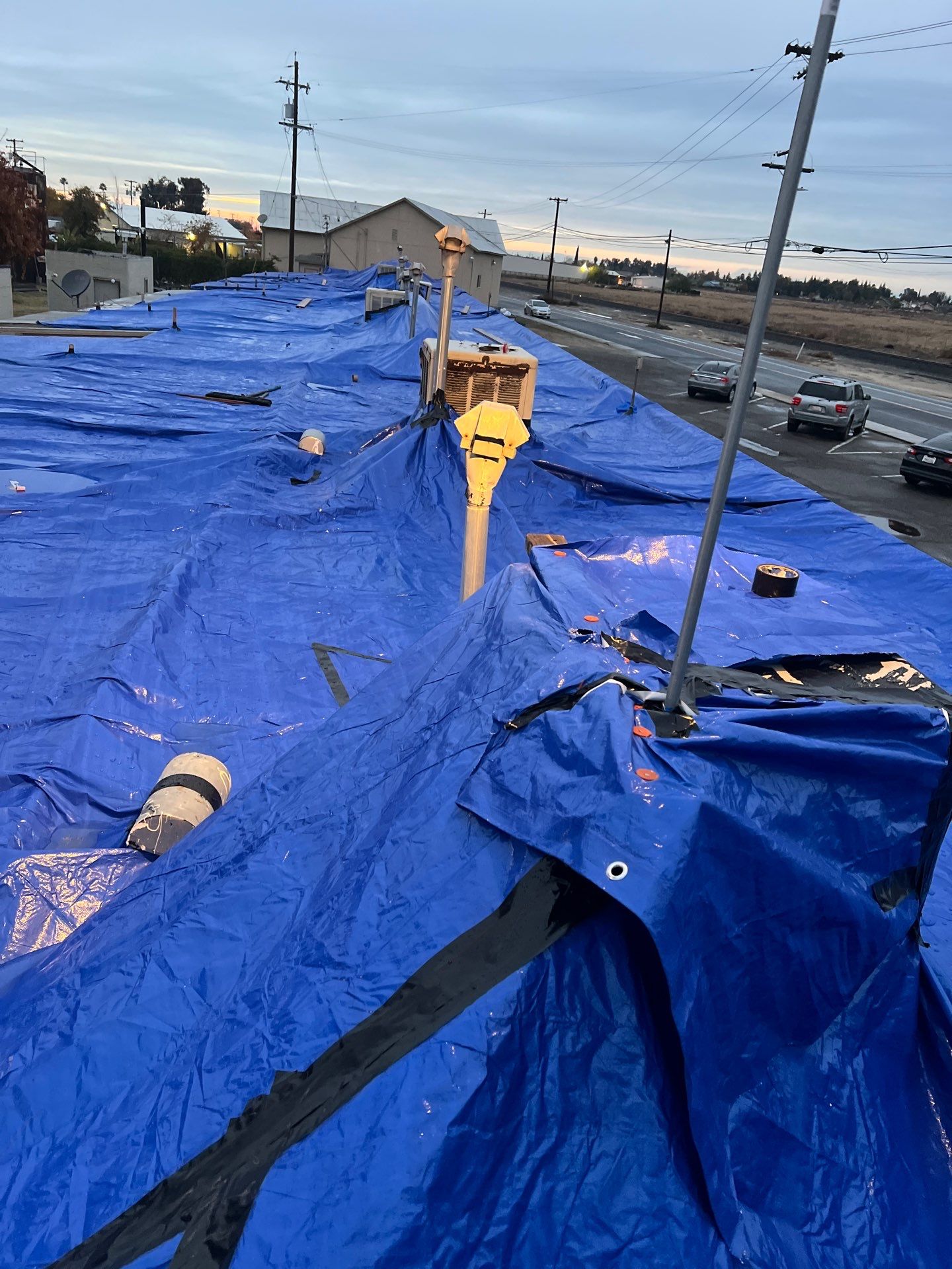 Emergency Roof Tarp Service - Fresno, CA by Grandmark Service Company