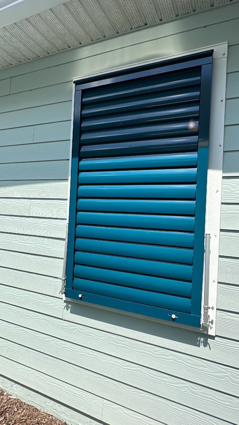 Hurricane Rated Bahama Shutters in Ocean Blue by Smart Guard Shutters