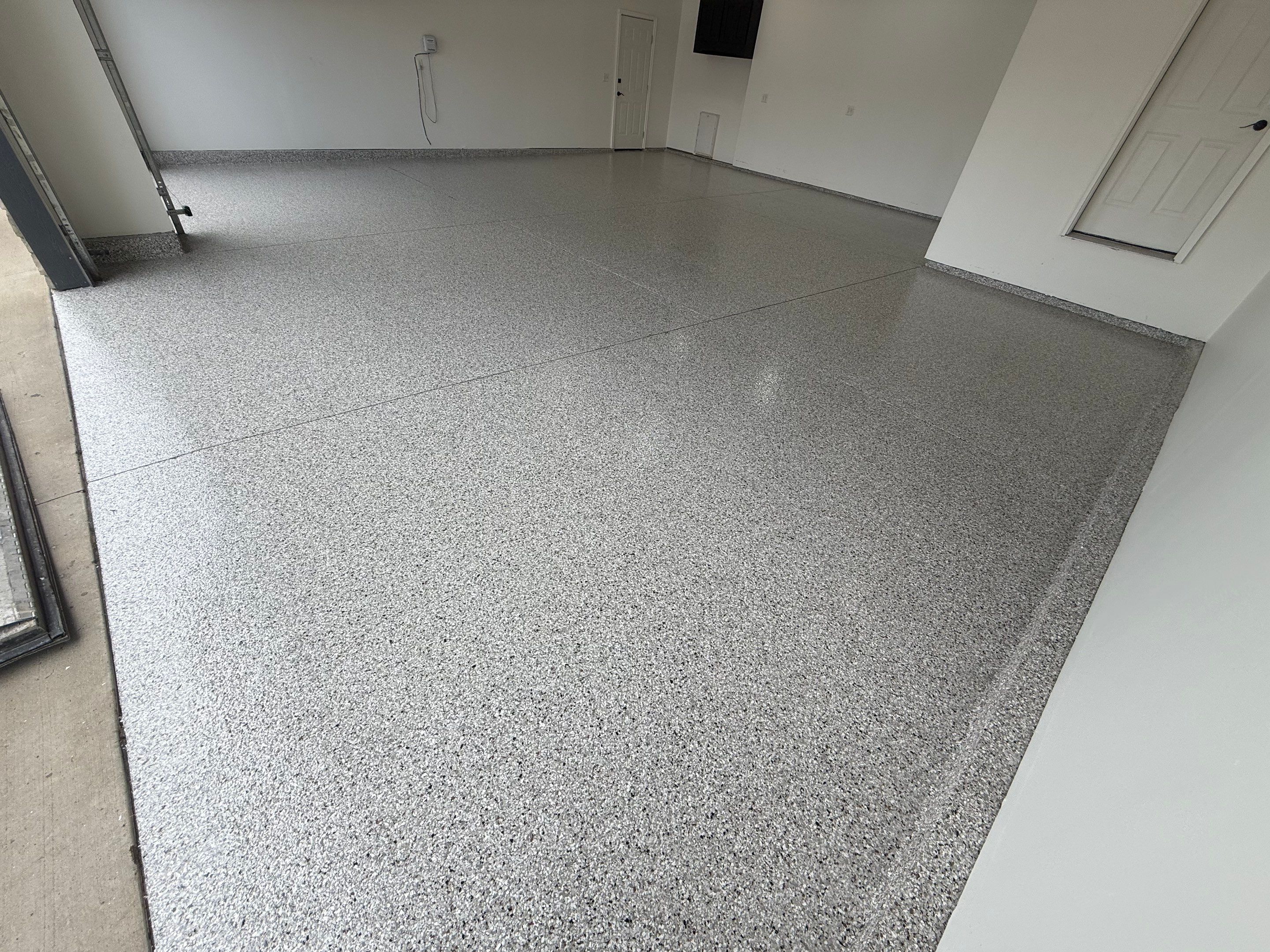 Full Garage Floor Resurfacing and Decorative Epoxy Flake Finish by Select Painting, Coatings & Garage Cabinets
