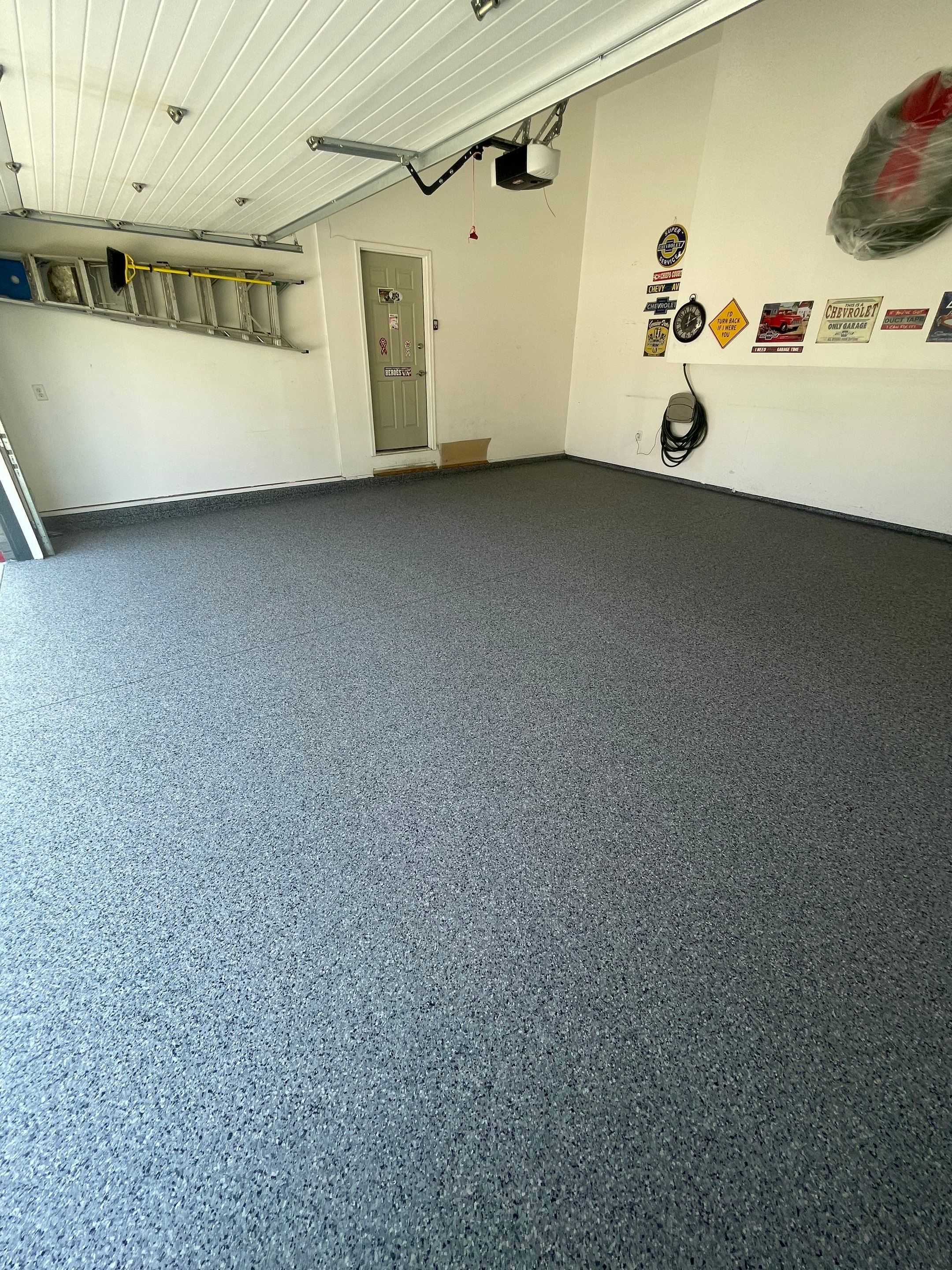 Sioux Falls Garage Floor Coating with Nightfall Decorative Chips by Select Painting, Coatings & Garage Cabinets