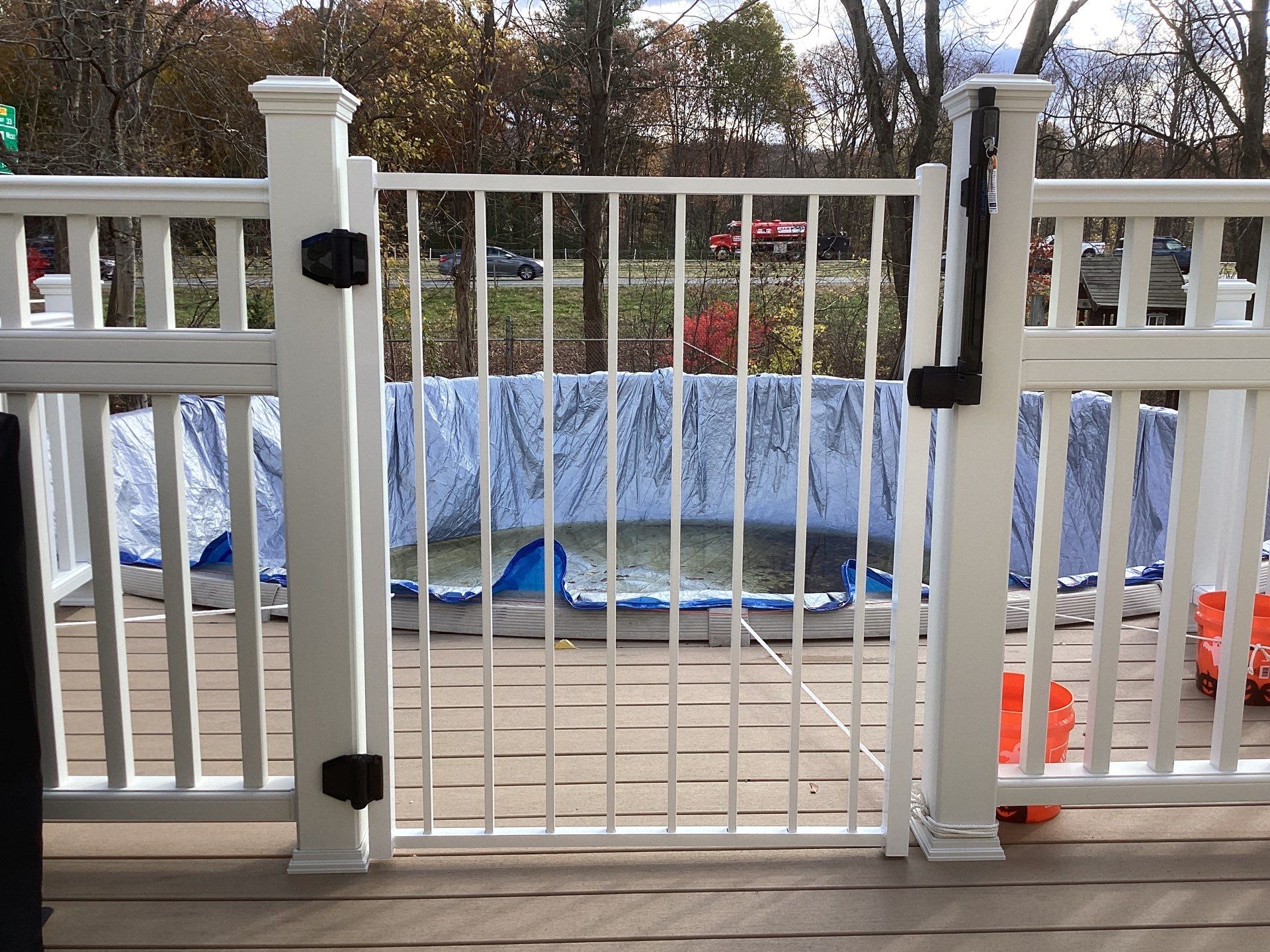 Replacement pool deck with Trex Lineage Carmel and Transcend railings by DiGiorgi Roofing and Siding Inc